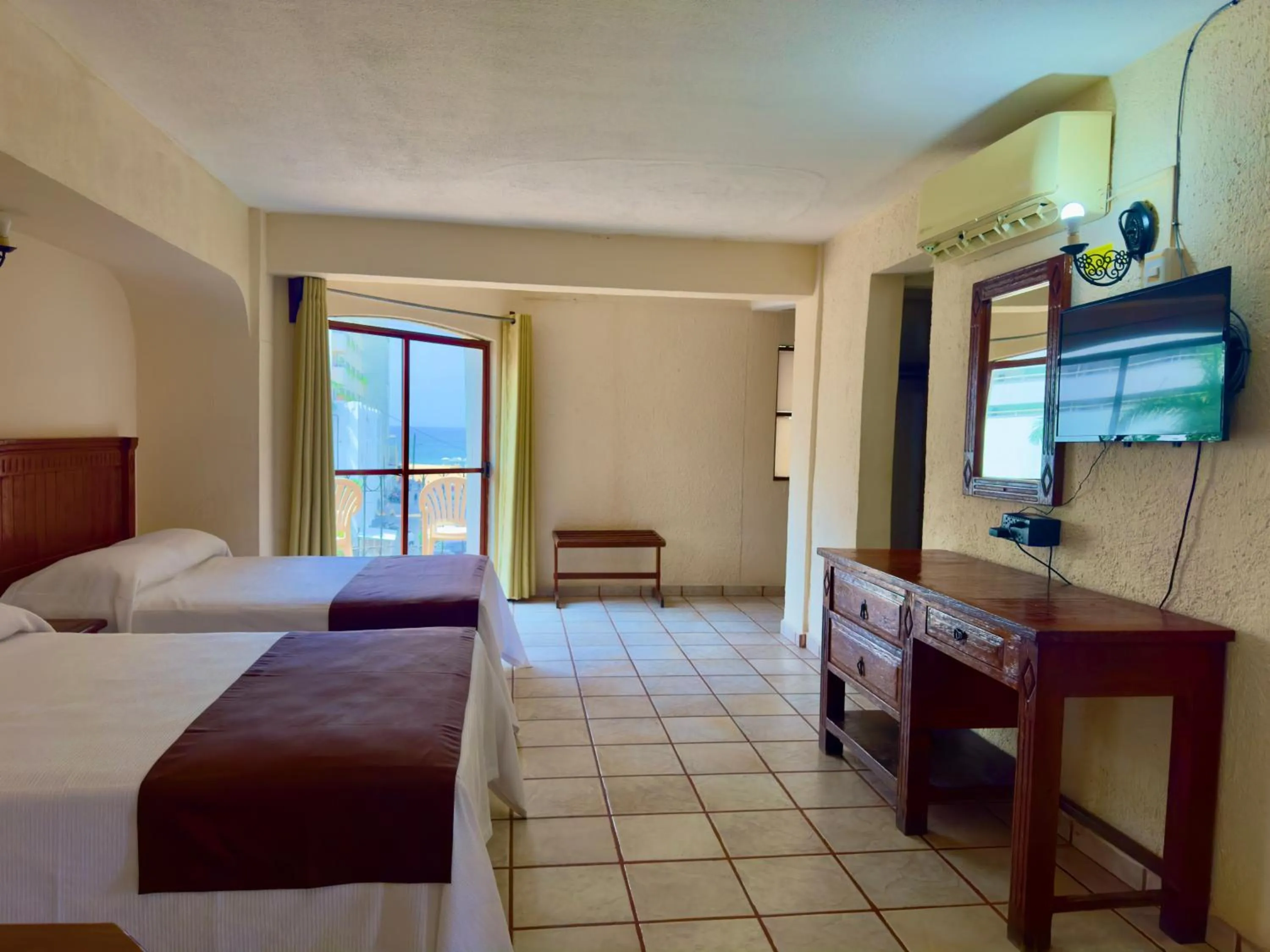 Bed in Hotel Hacienda María Eugenia Acapulco