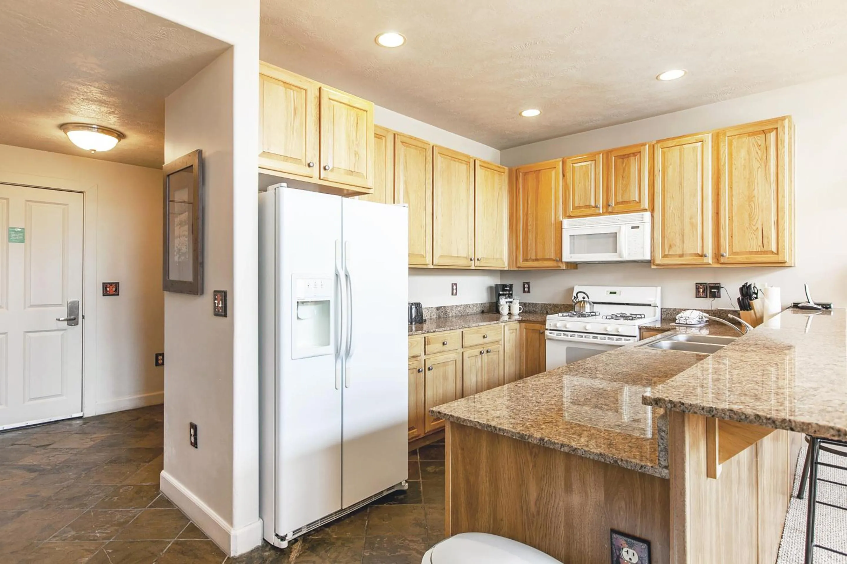 kitchen in Crestview Condominiums by All Seasons Resort Lodging
