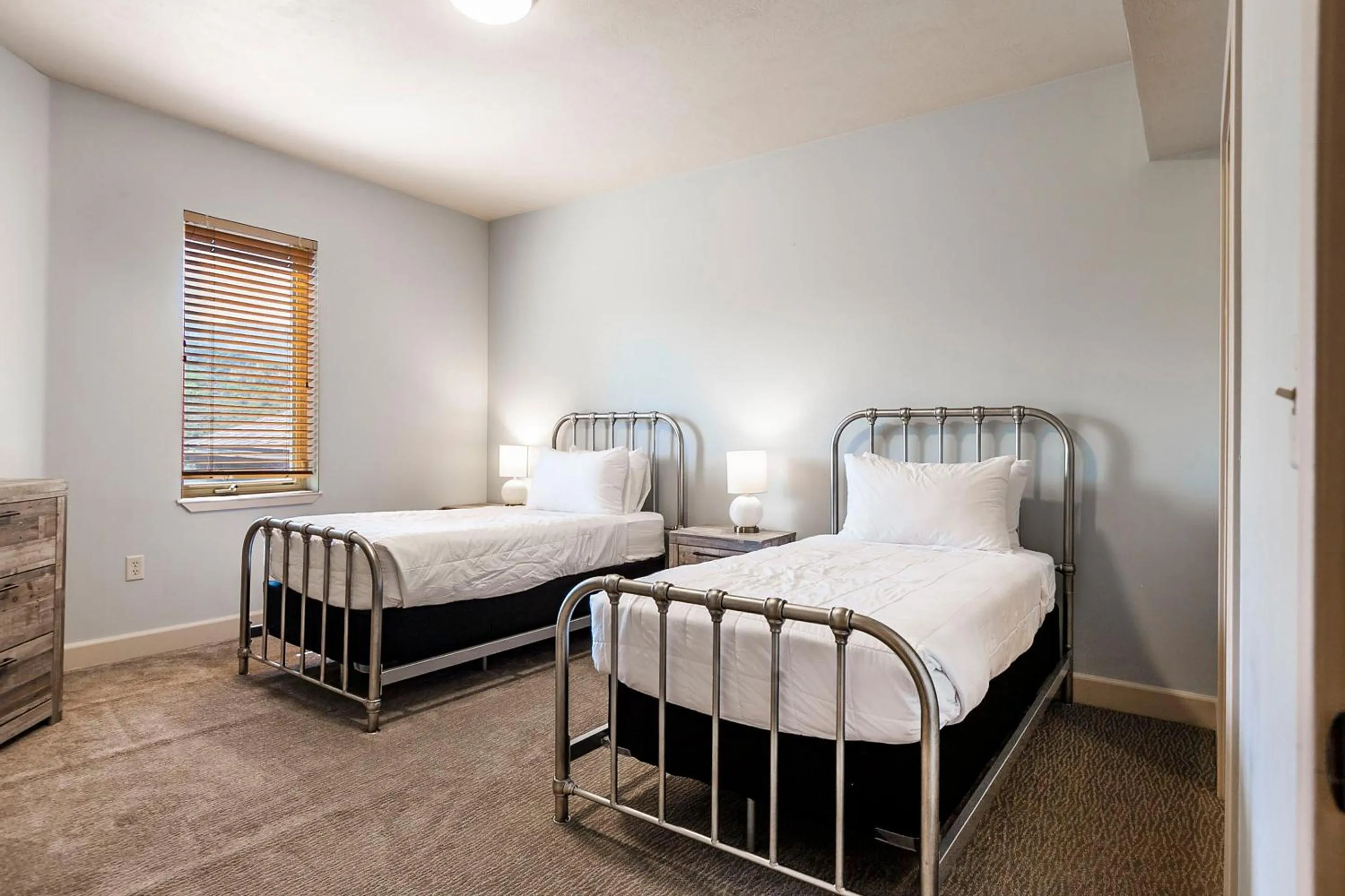 Bed in Crestview Condominiums by All Seasons Resort Lodging