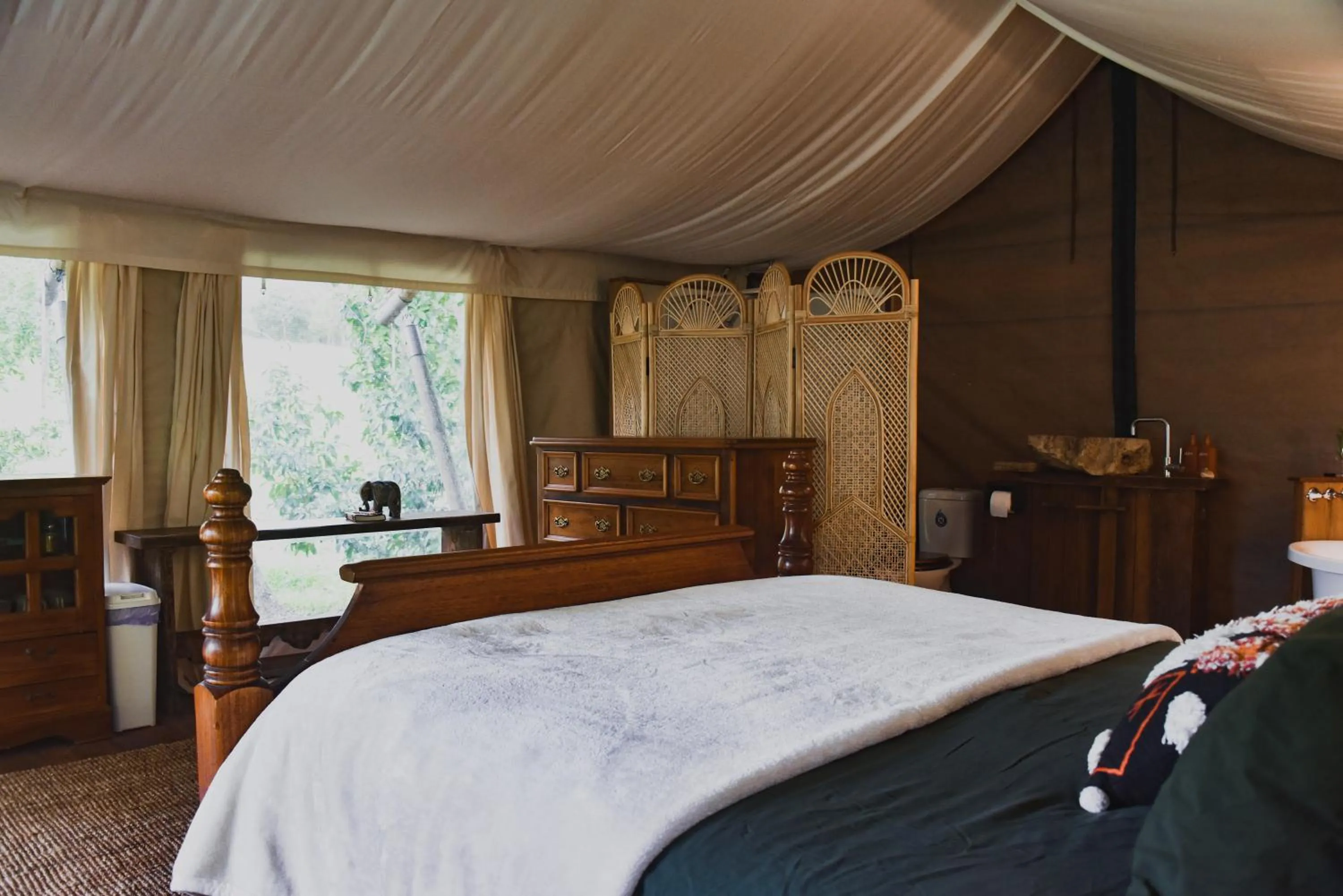 Guests, Bed in Silk Pavilions Glamping
