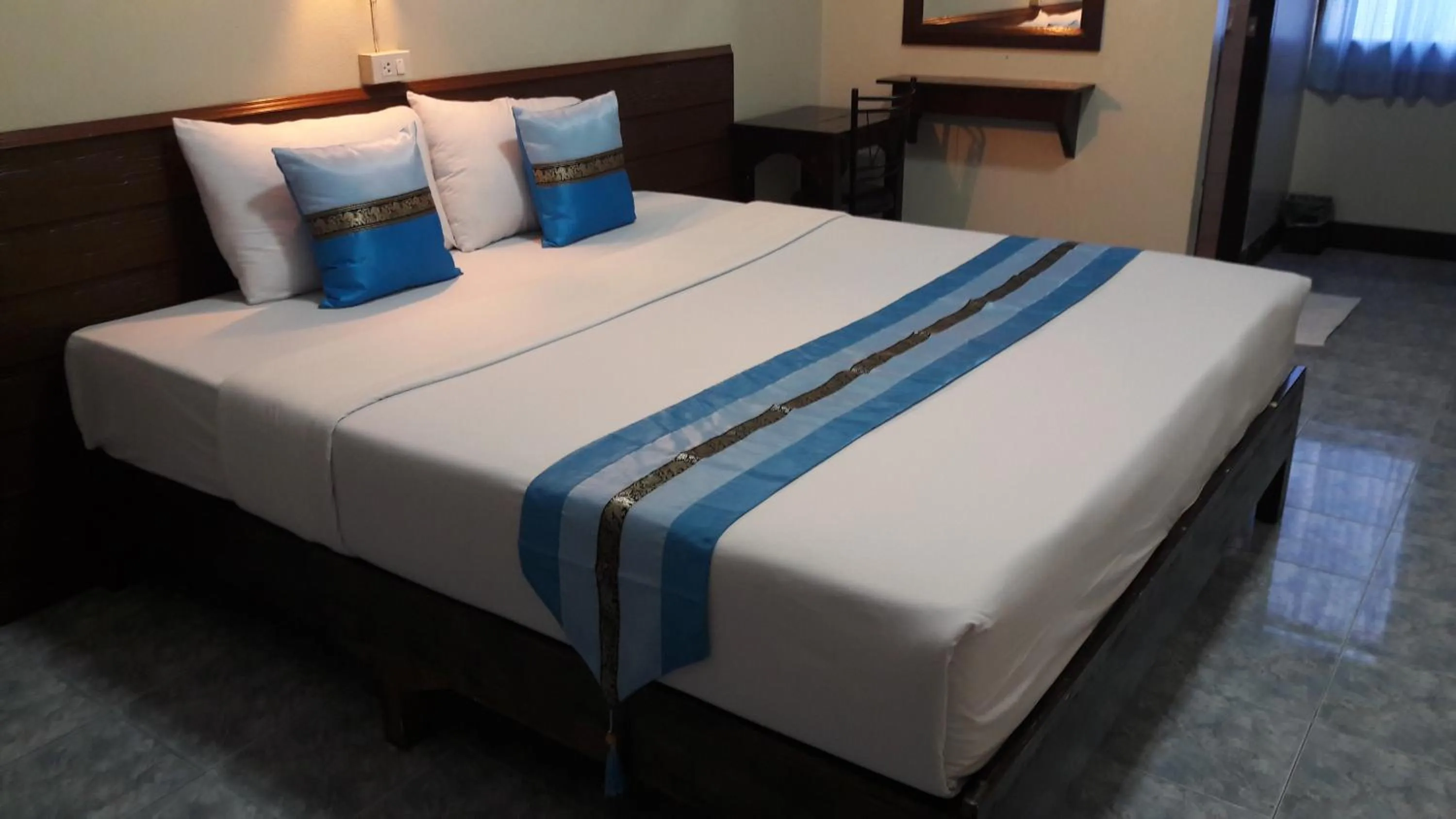 Bed in Lanna Thai Guesthouse