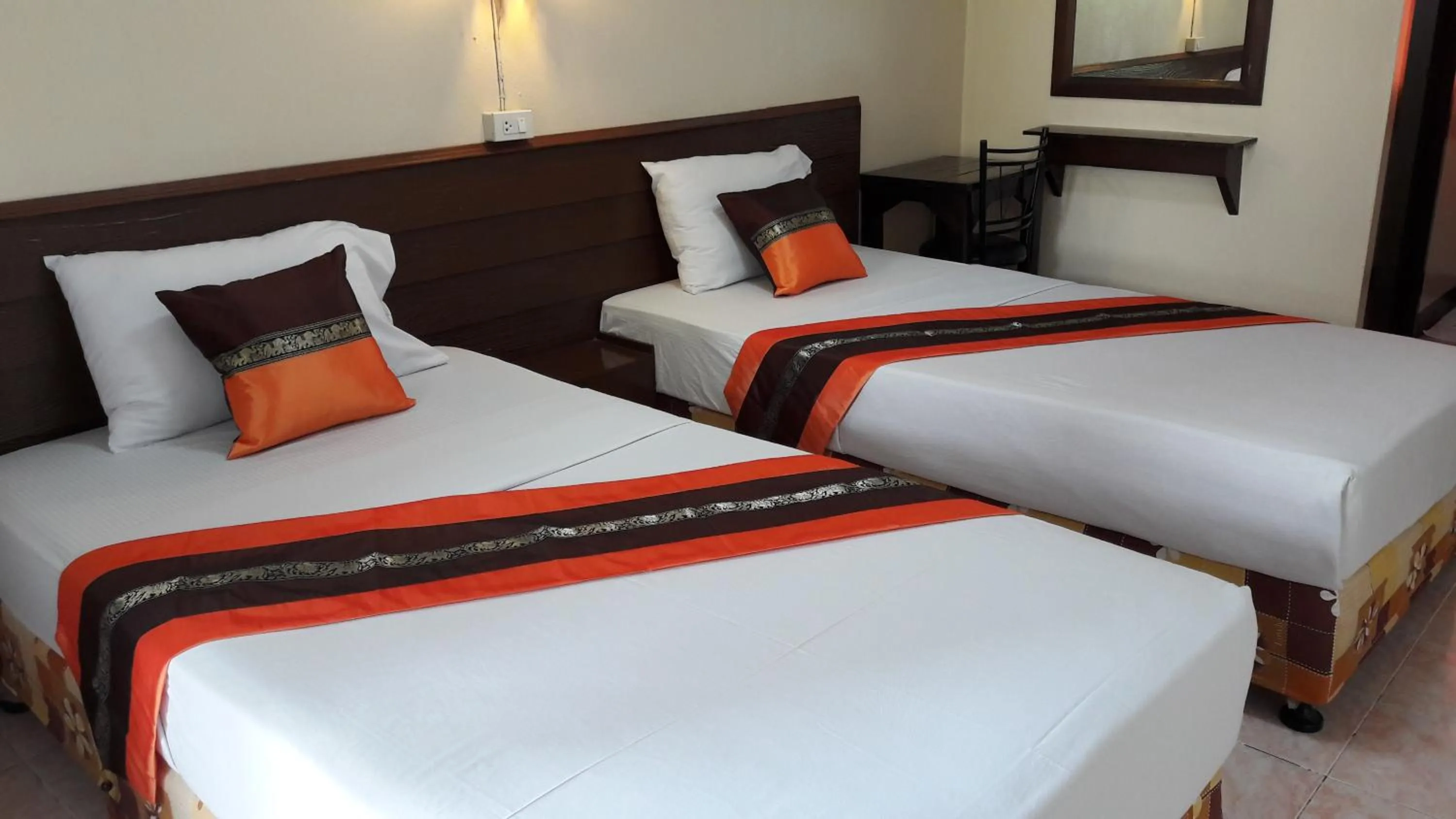 Bed in Lanna Thai Guesthouse