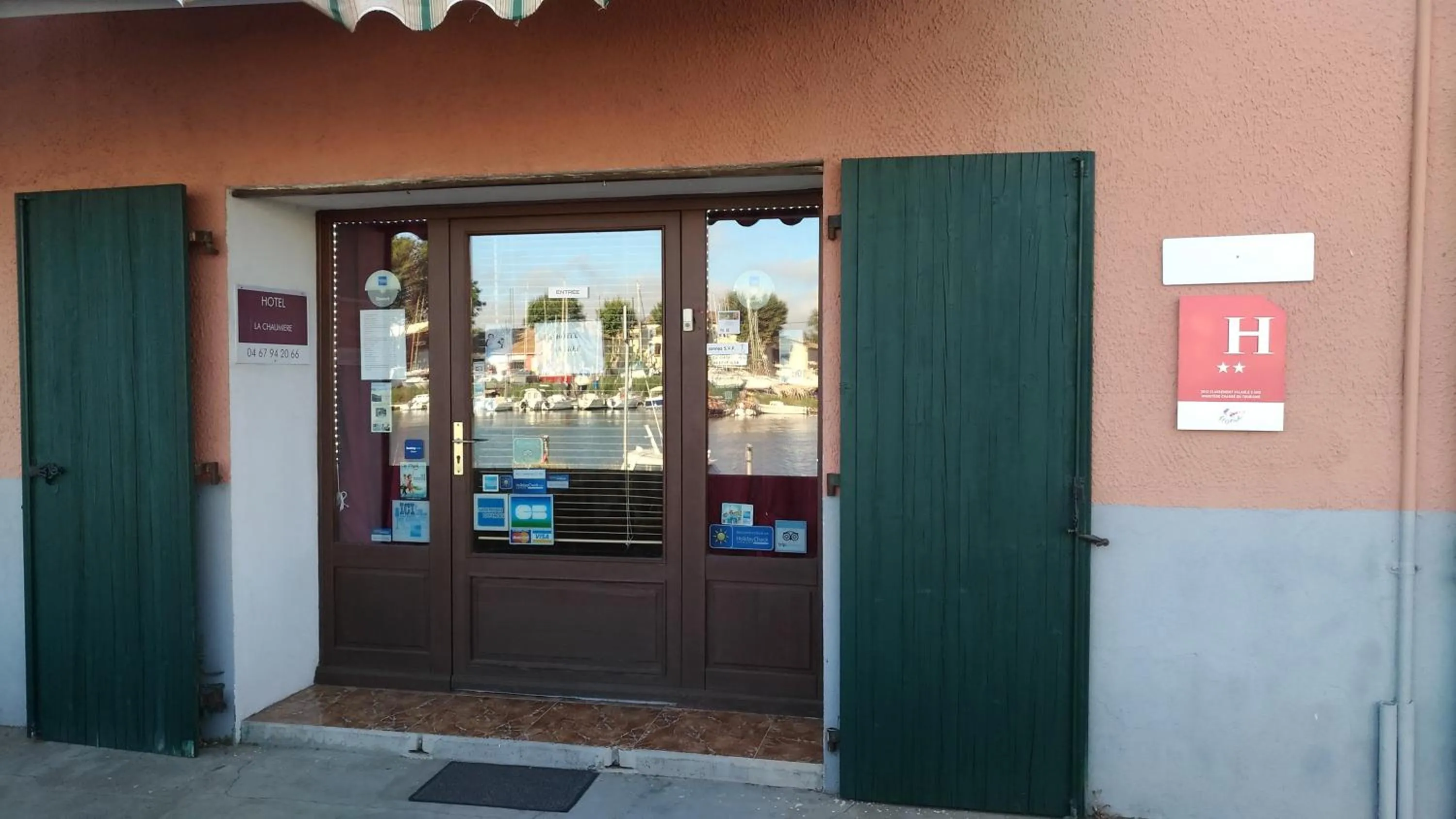 Property logo or sign in La Chaumiere d Agde