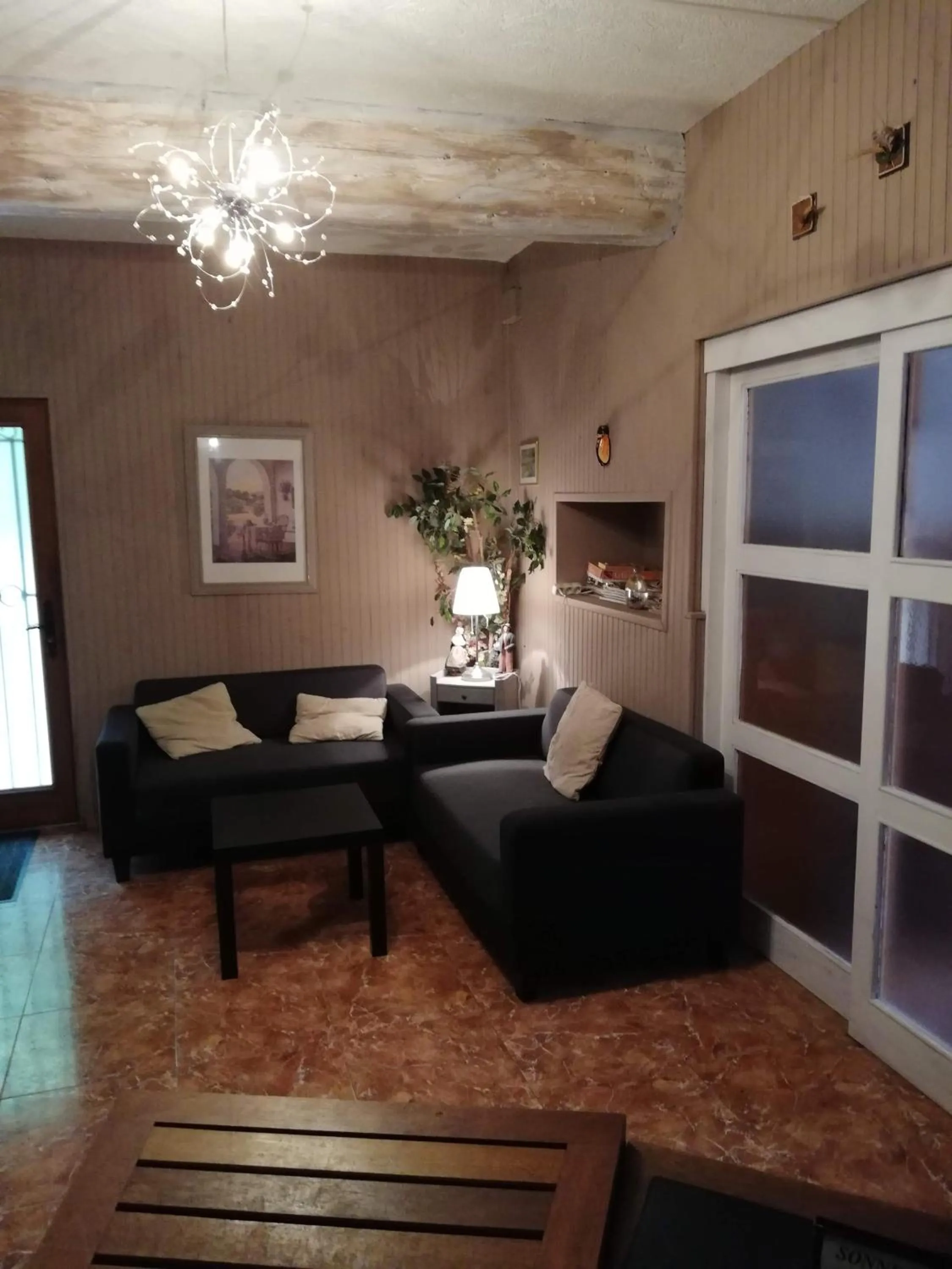 Communal lounge/ TV room in La Chaumiere d Agde