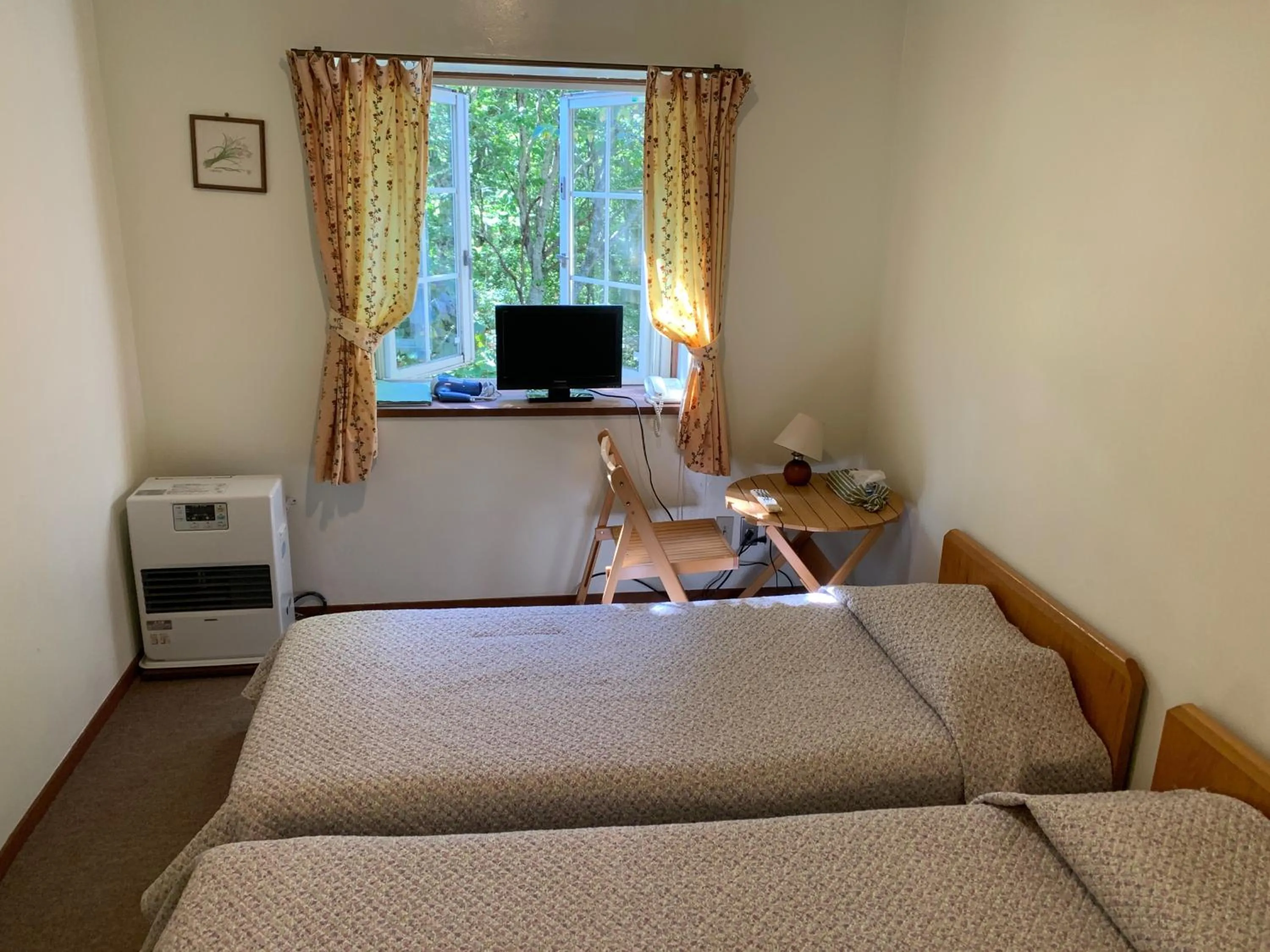 Photo of the whole room, Bed in Pension Rapport in Tambara Plateau