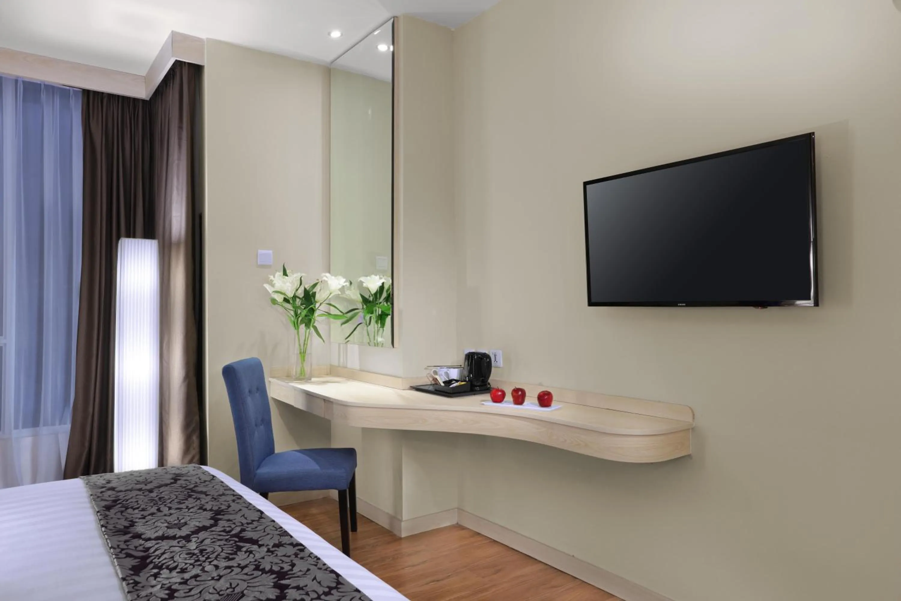 Seating area, Bed in Aston Batam Hotel & Residence