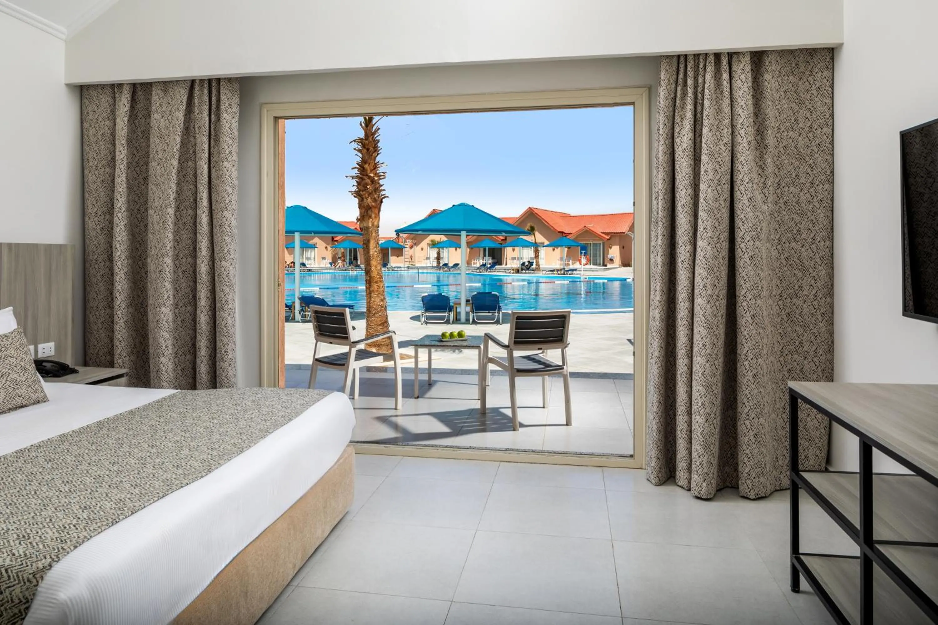 Pool view, Bed in Pickalbatros Jungle Aqua Park - Neverland Hurghada