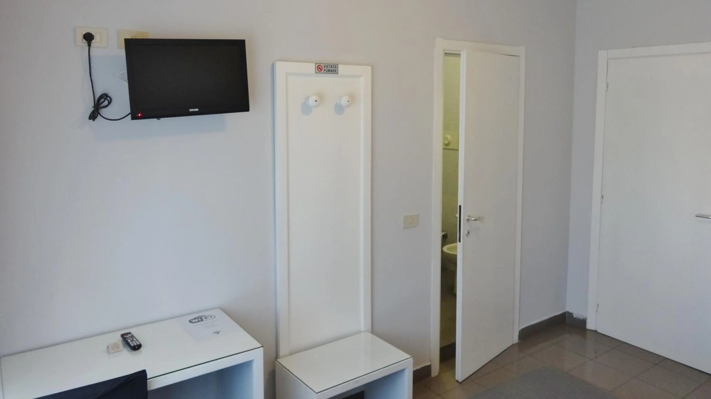 TV and multimedia, TV/Entertainment Center in Hotel Marte