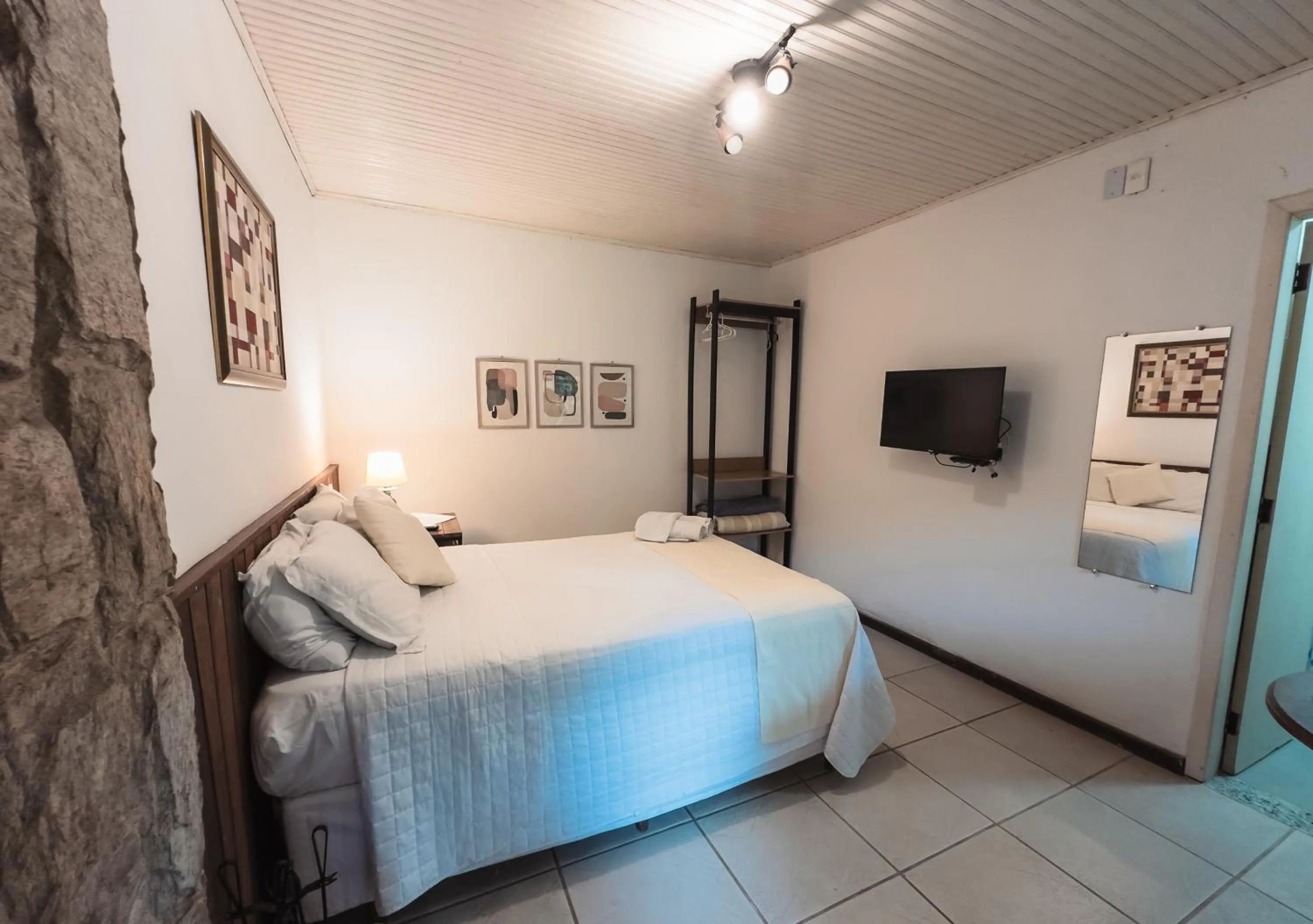 Bed in Pousada Flor de Penedo