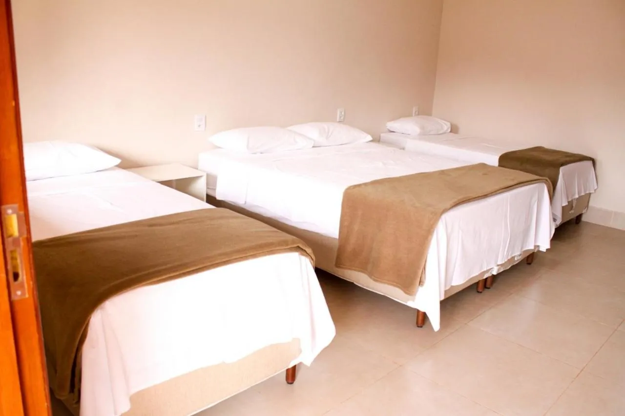 Bed in Chalés Cantinho da Roça