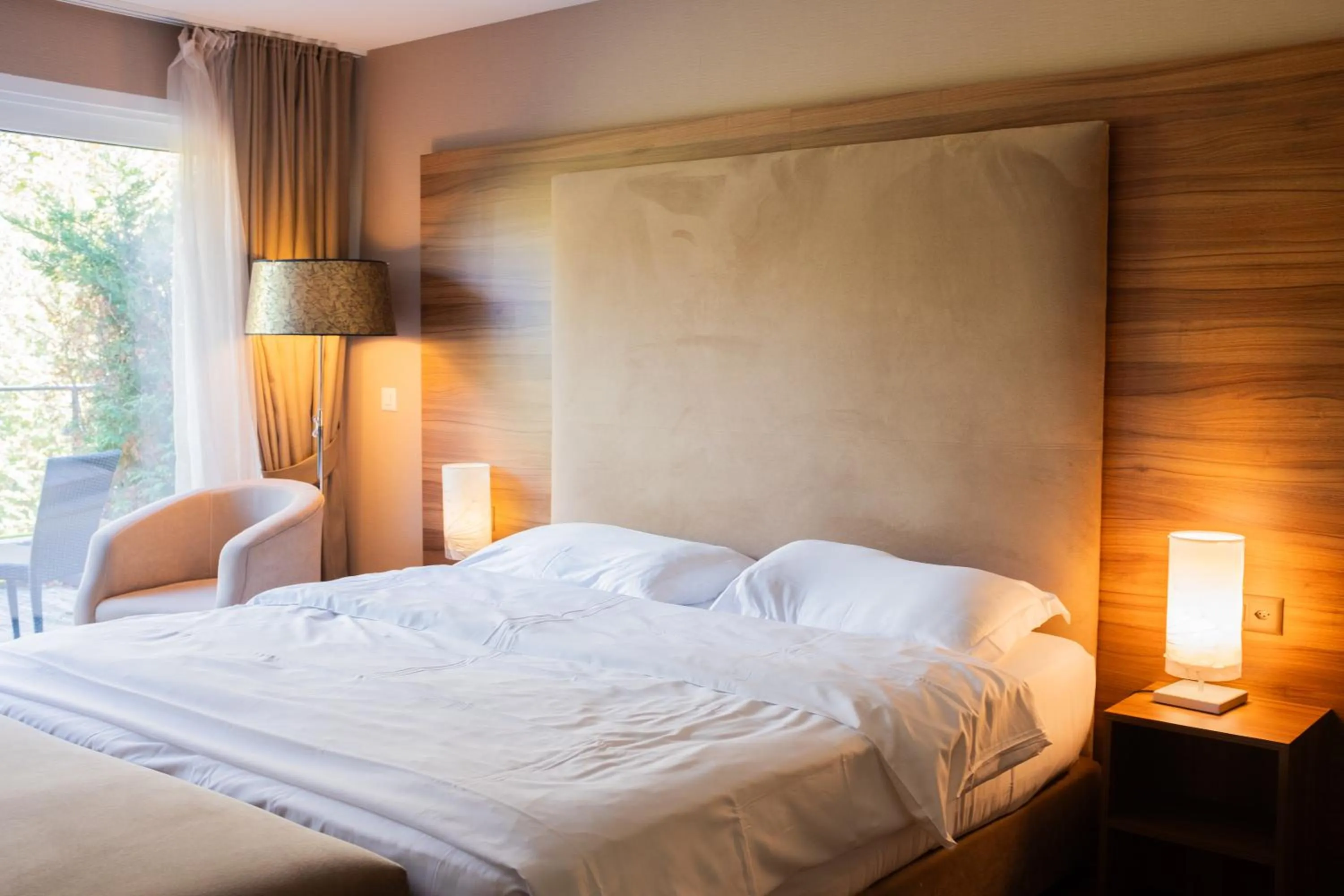 Bed in Baron Tavernier Hotel Restaurant & SPA