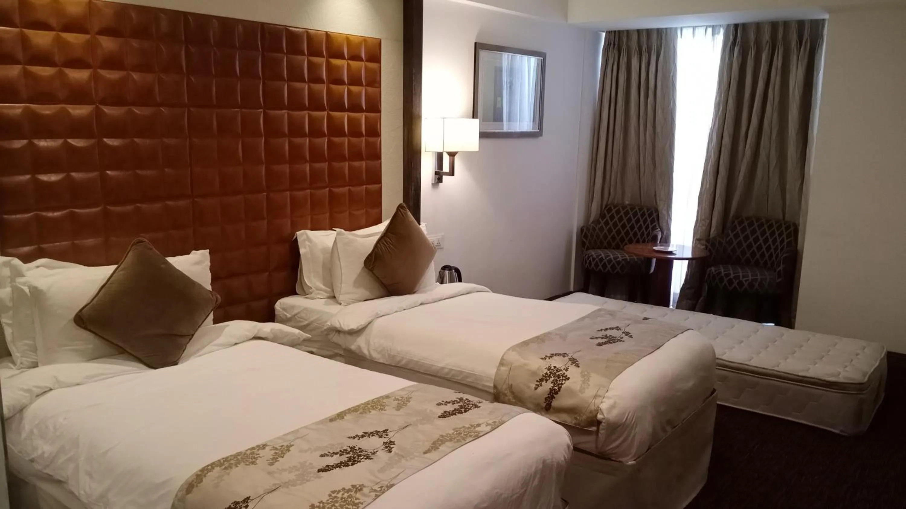 Bedroom, Bed in Regenta Central Hotel & Convention Centre Nagpur