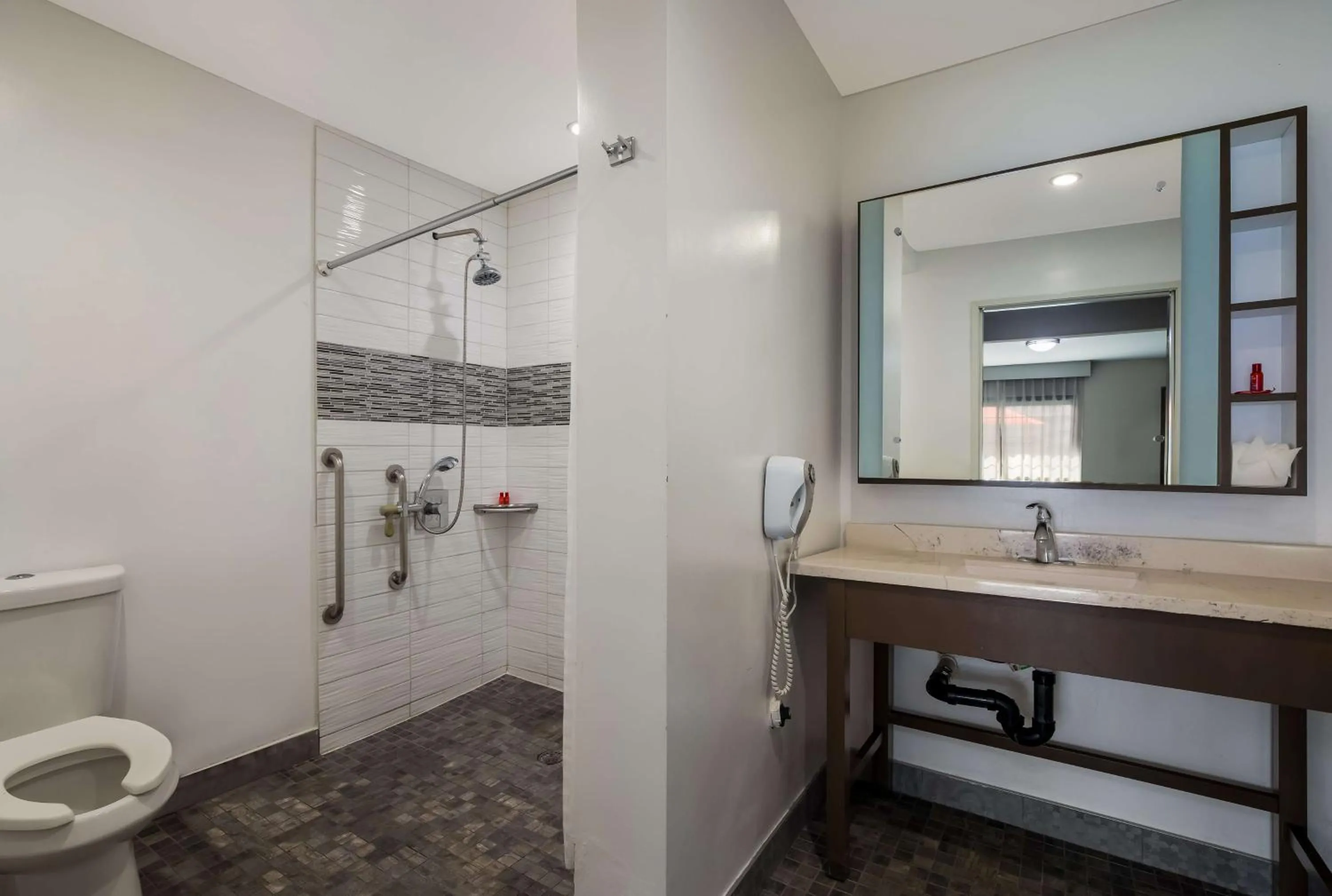 Bathroom in Sunset West Hotel, SureStay Collection By Best Western