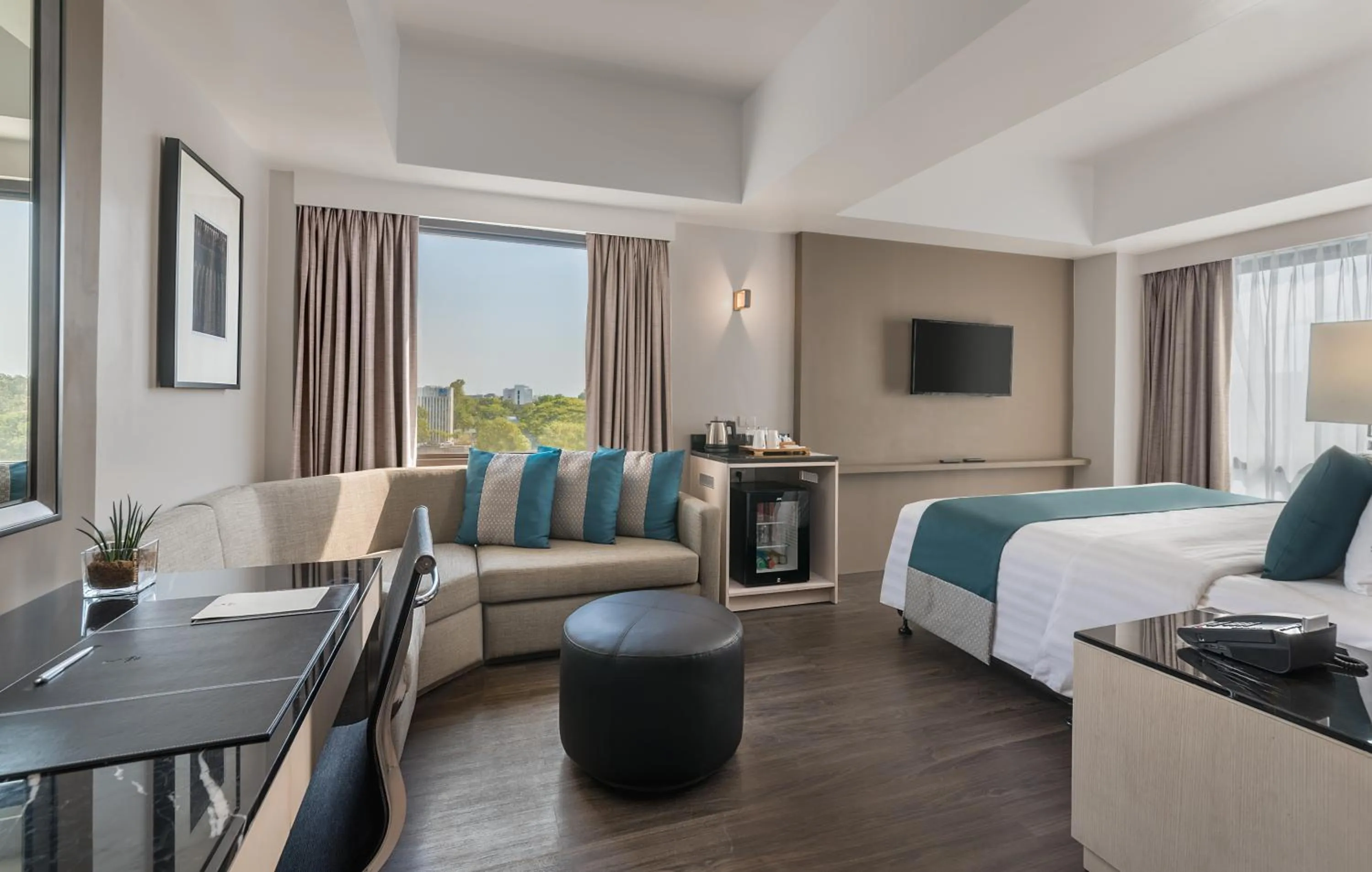 Seating area, Bed in Seda Capitol Central Hotel