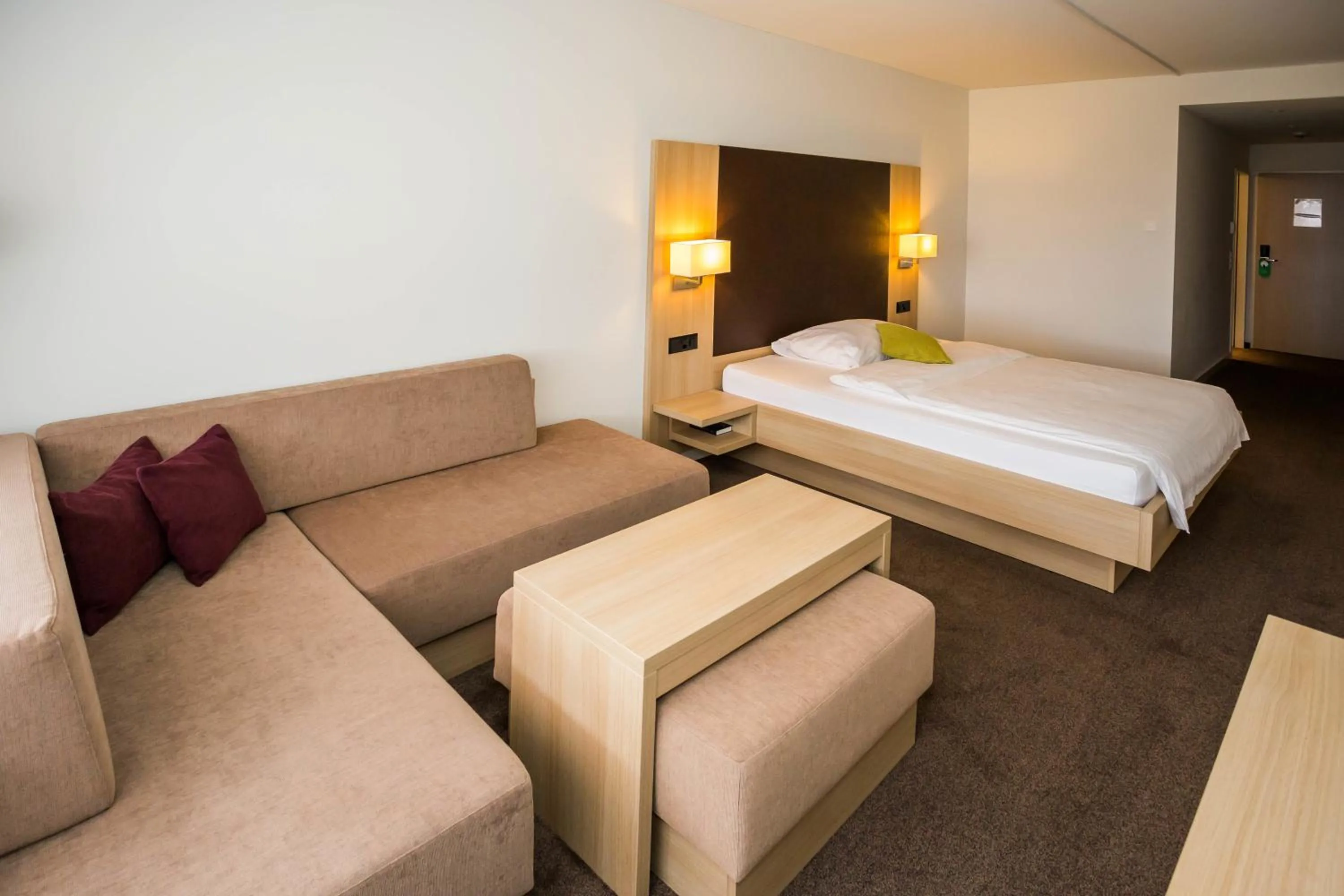 Seating area, Bed in Hotel Höri Inn