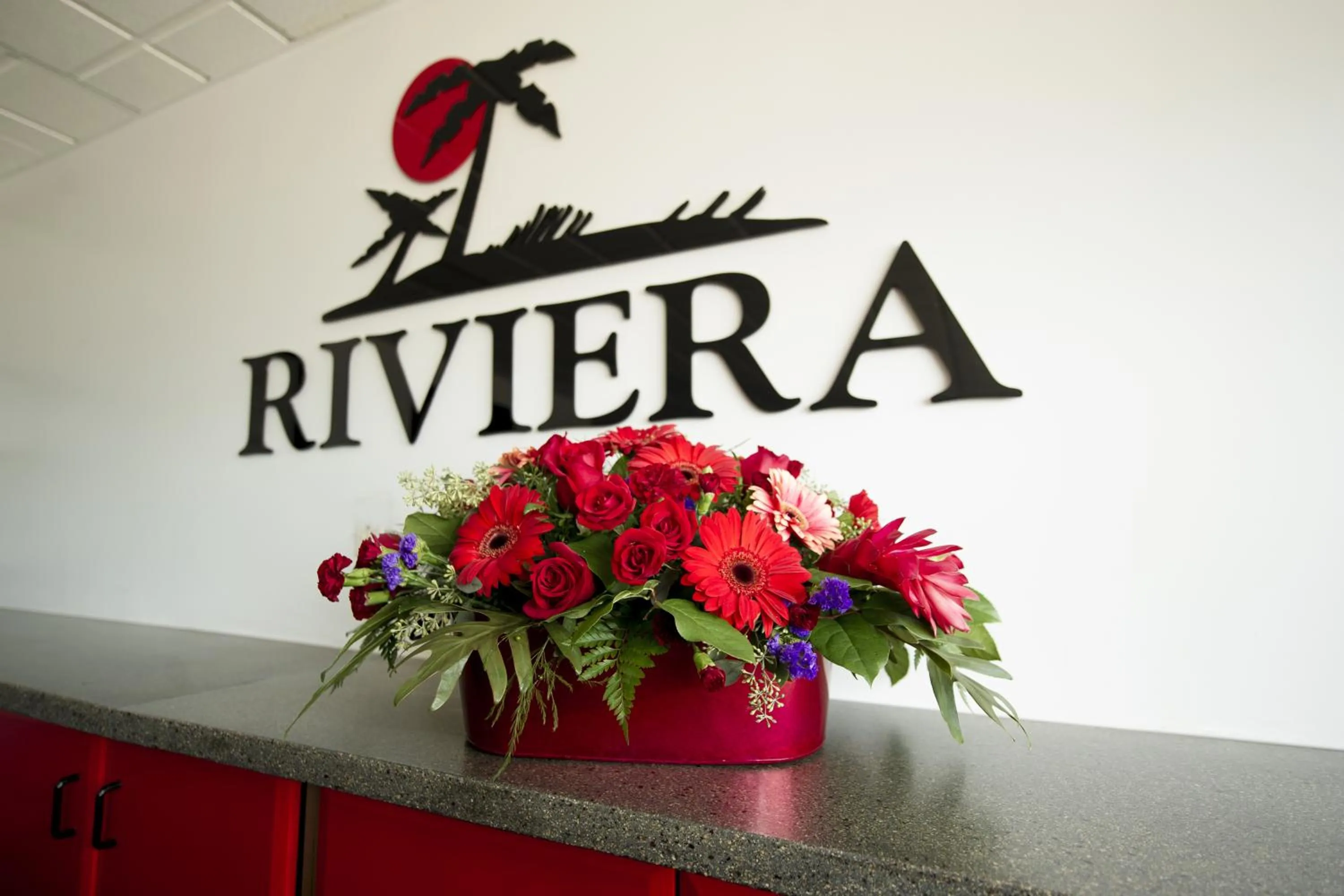 Property logo or sign in Riviera Motor Inn