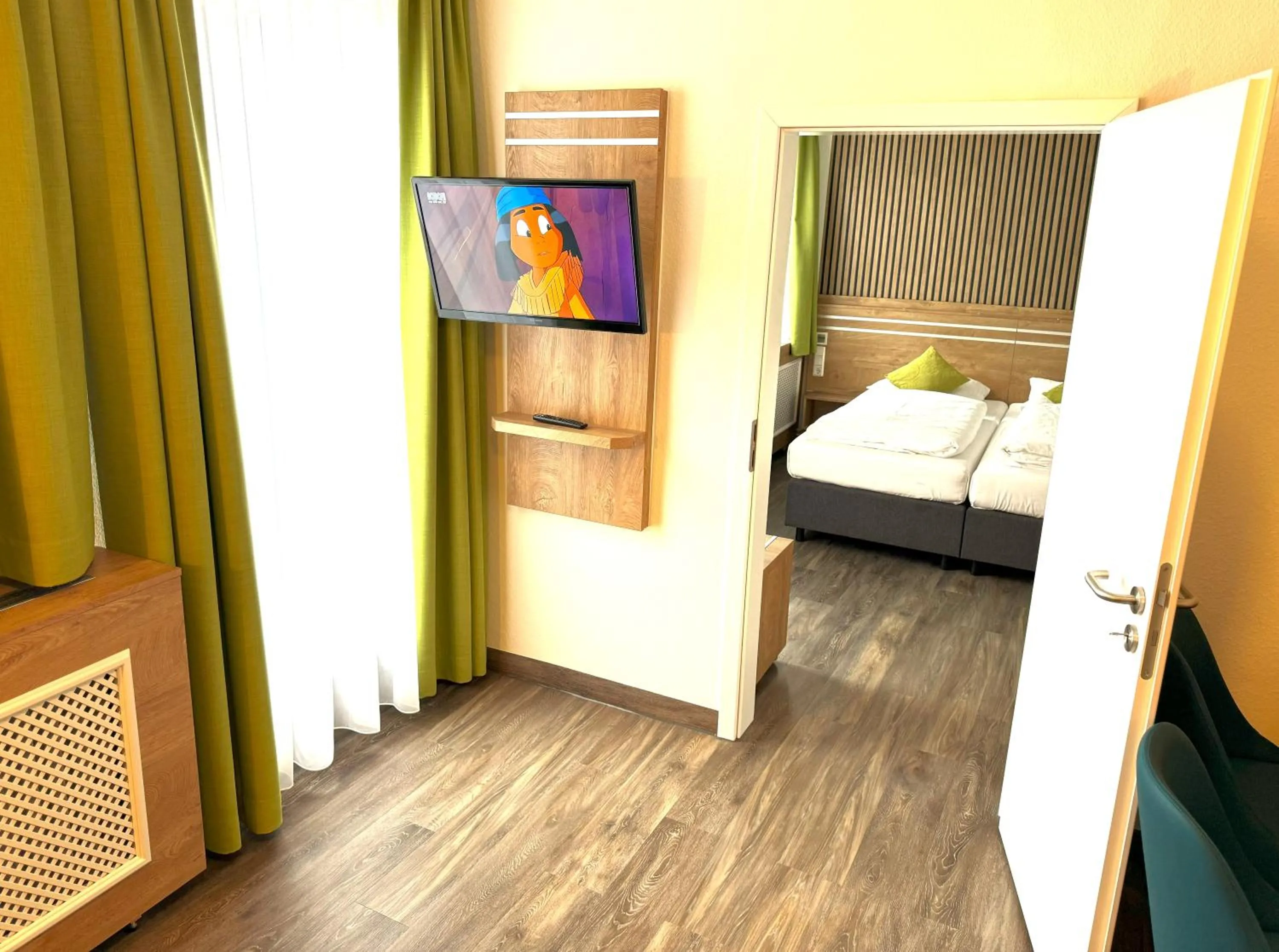 Living room, Bed in Berghotel Glockenberg