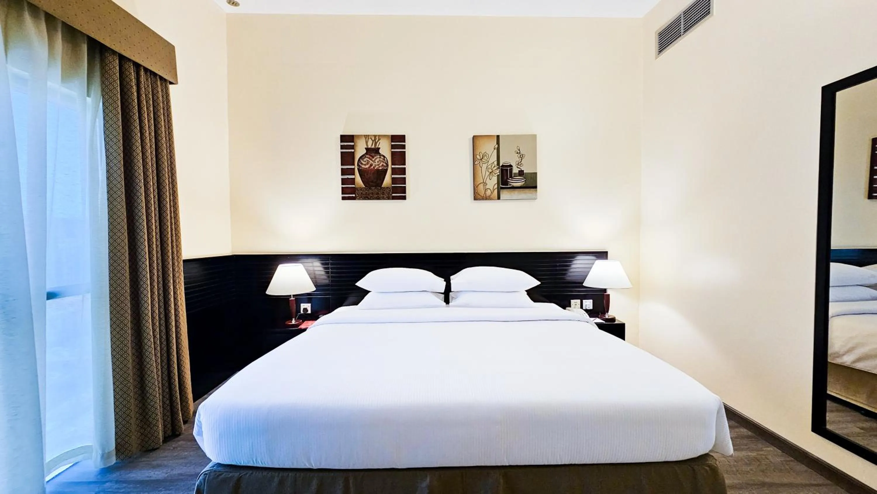 Bed in Ramada Hotel & Suites by Wyndham Ajman