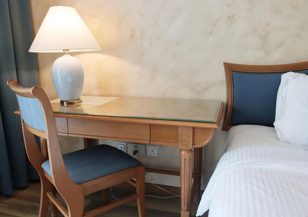 Bed in Grand Palace Hotel