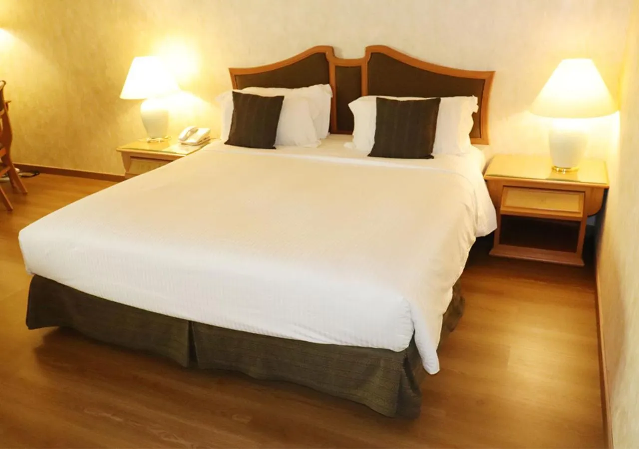 Bed in Grand Palace Hotel