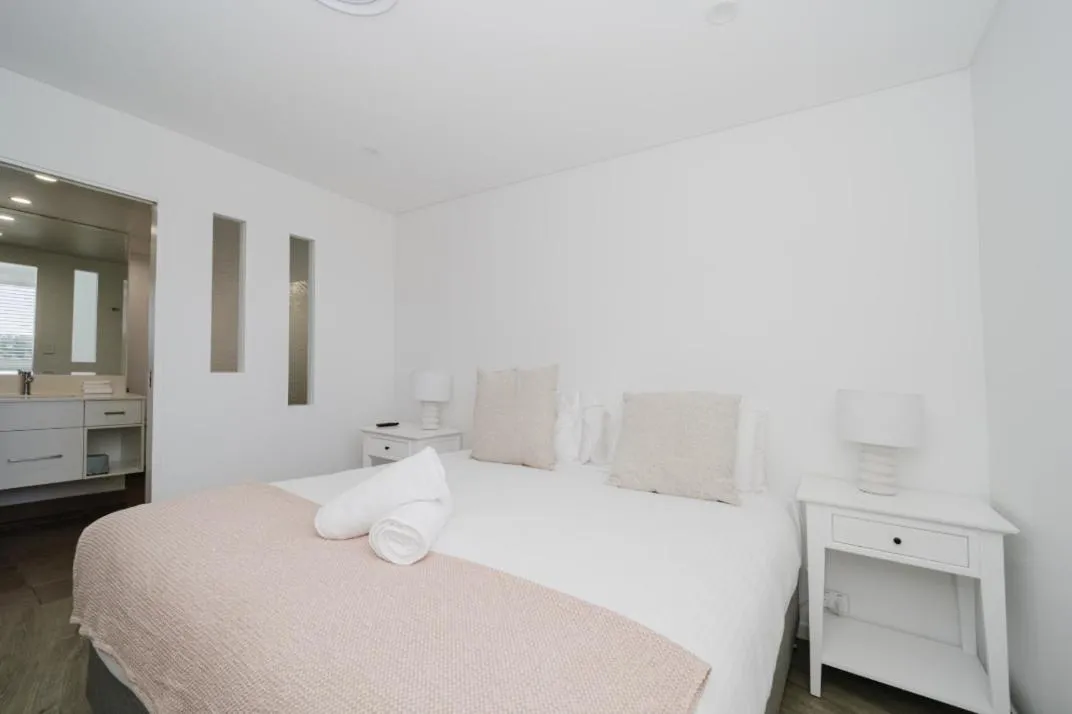 Bed in Bay Royal Apartments