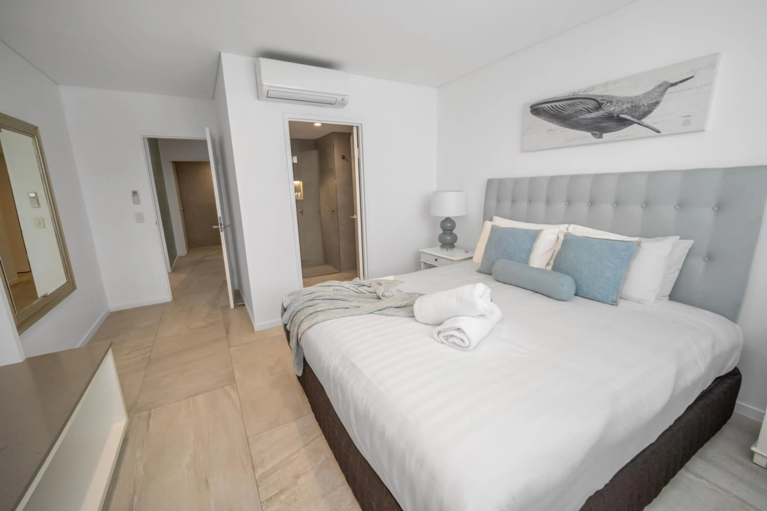 Bed in Bay Royal Apartments