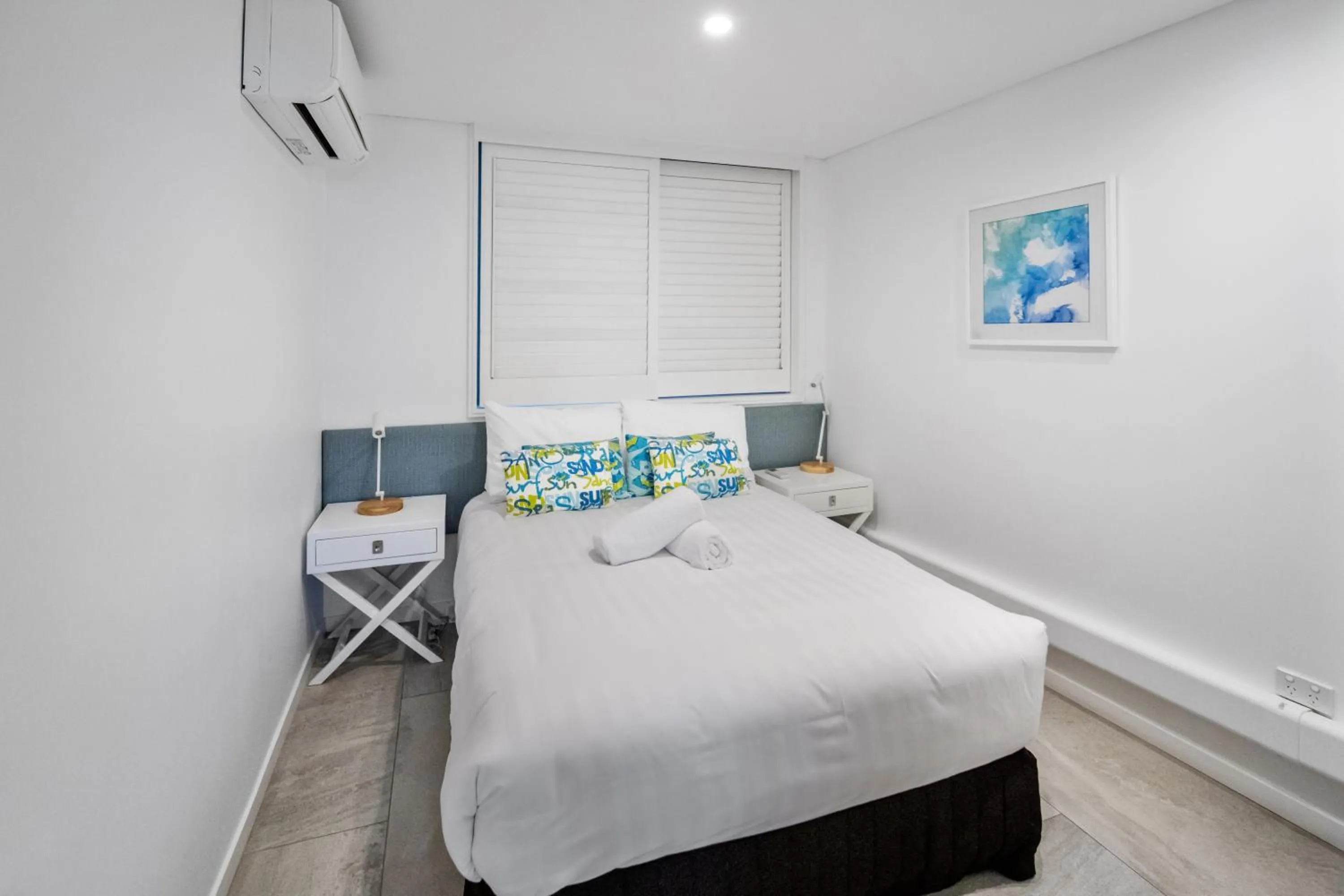 Bed in Bay Royal Apartments