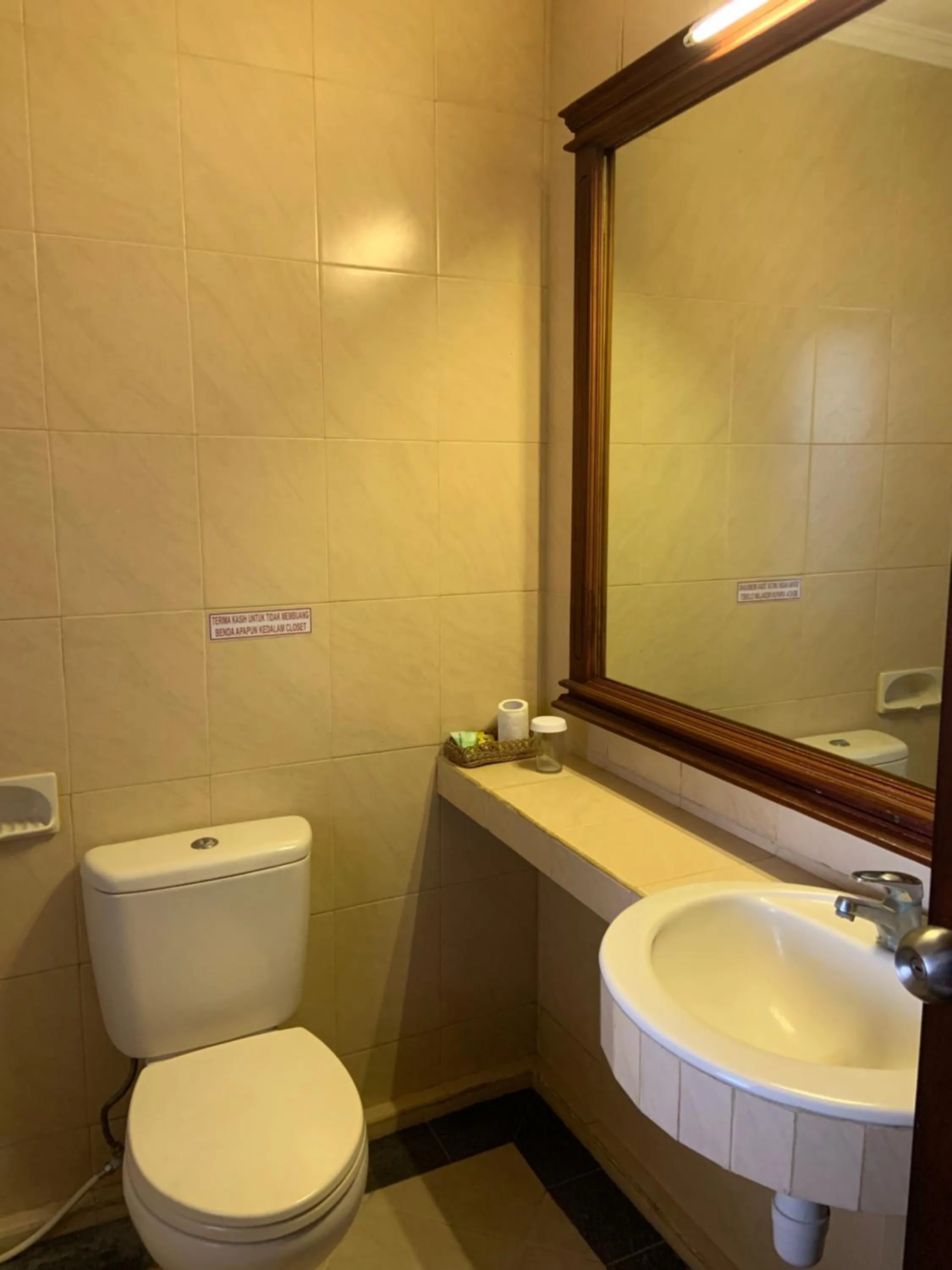 Toilet in Nirwana Suites