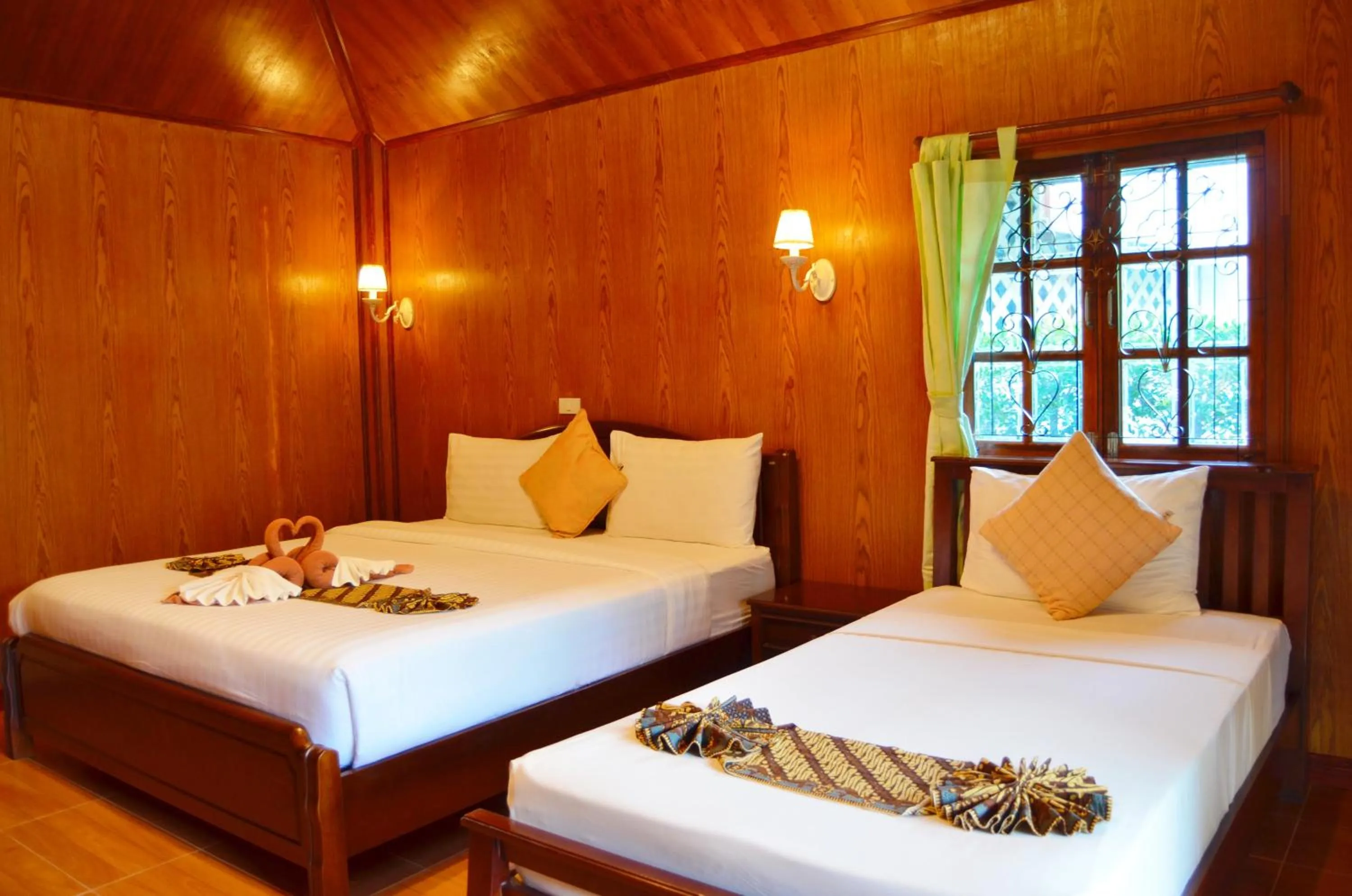 Photo of the whole room, Bed in Sayang Beach Resort Koh Lanta