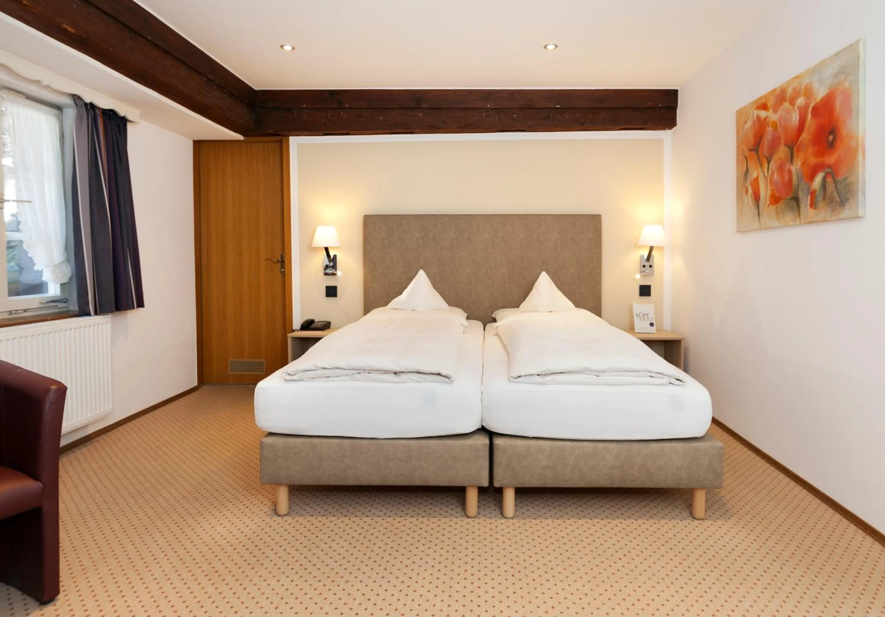 Bed in Romantik Hotel Johanniter-Kreuz