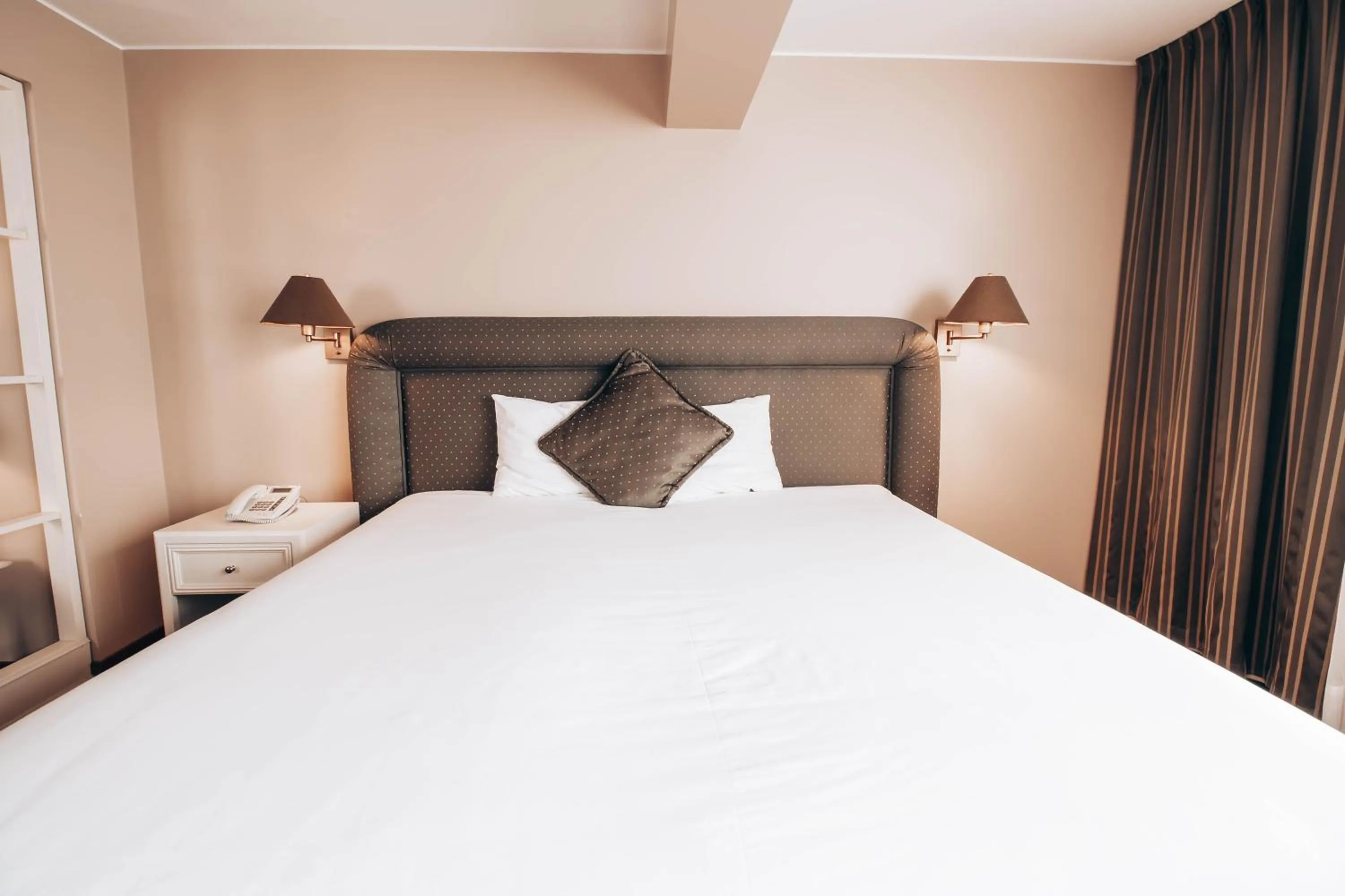 Bed in Suites del Bosque Hotel