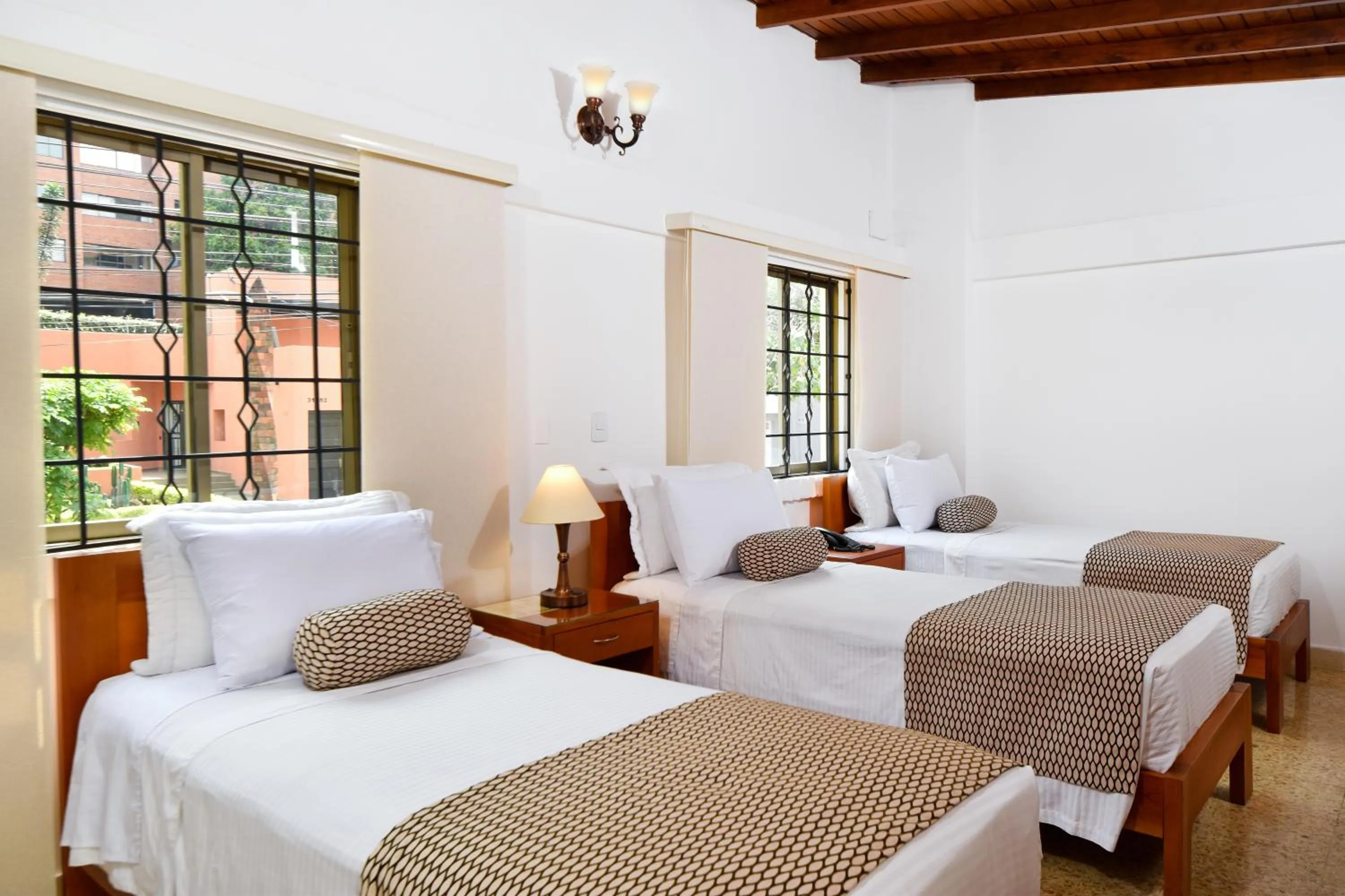Bed in La Campana Hotel Boutique