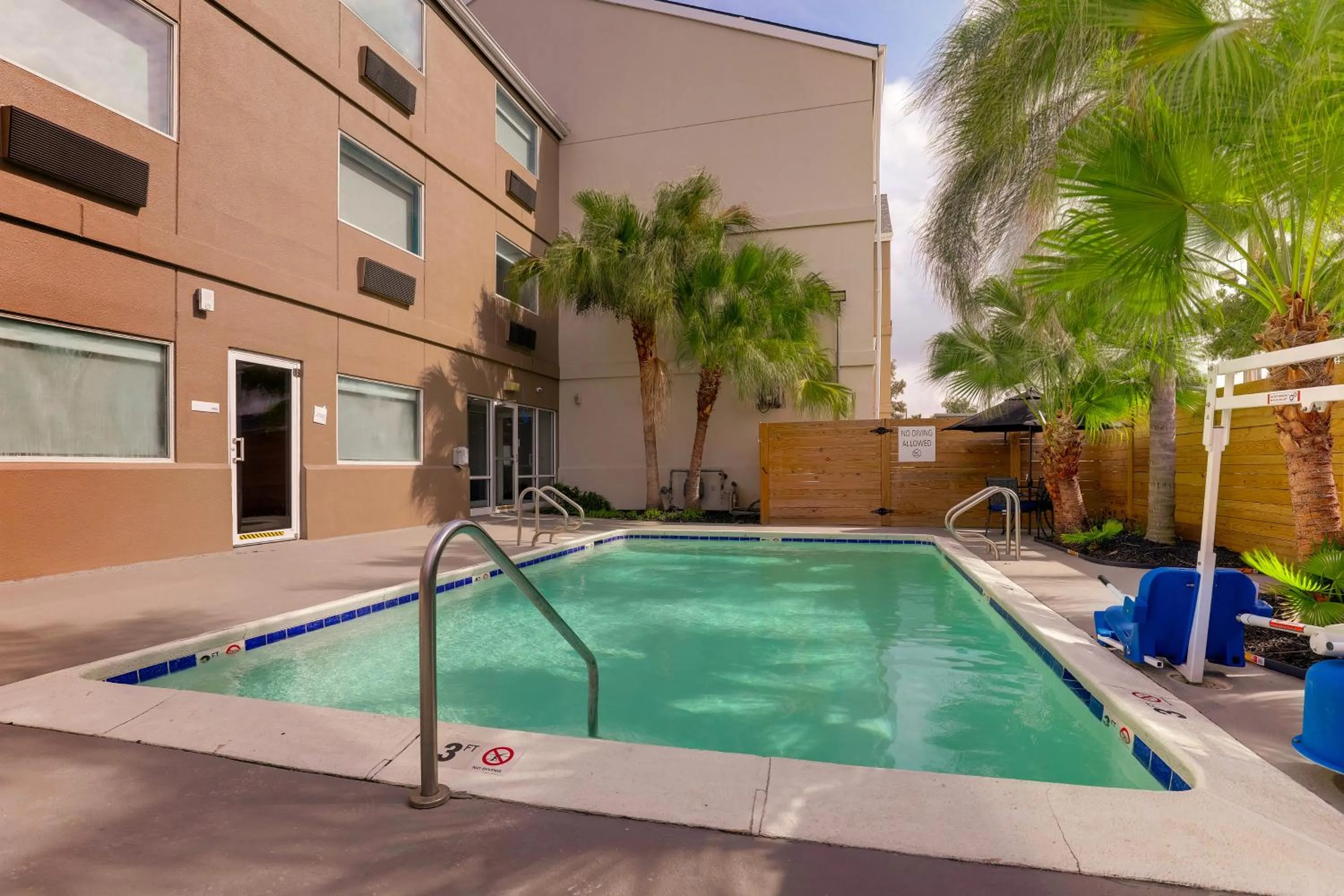 Pool view in Holiday Inn Express Kenner - New Orleans Airport by IHG