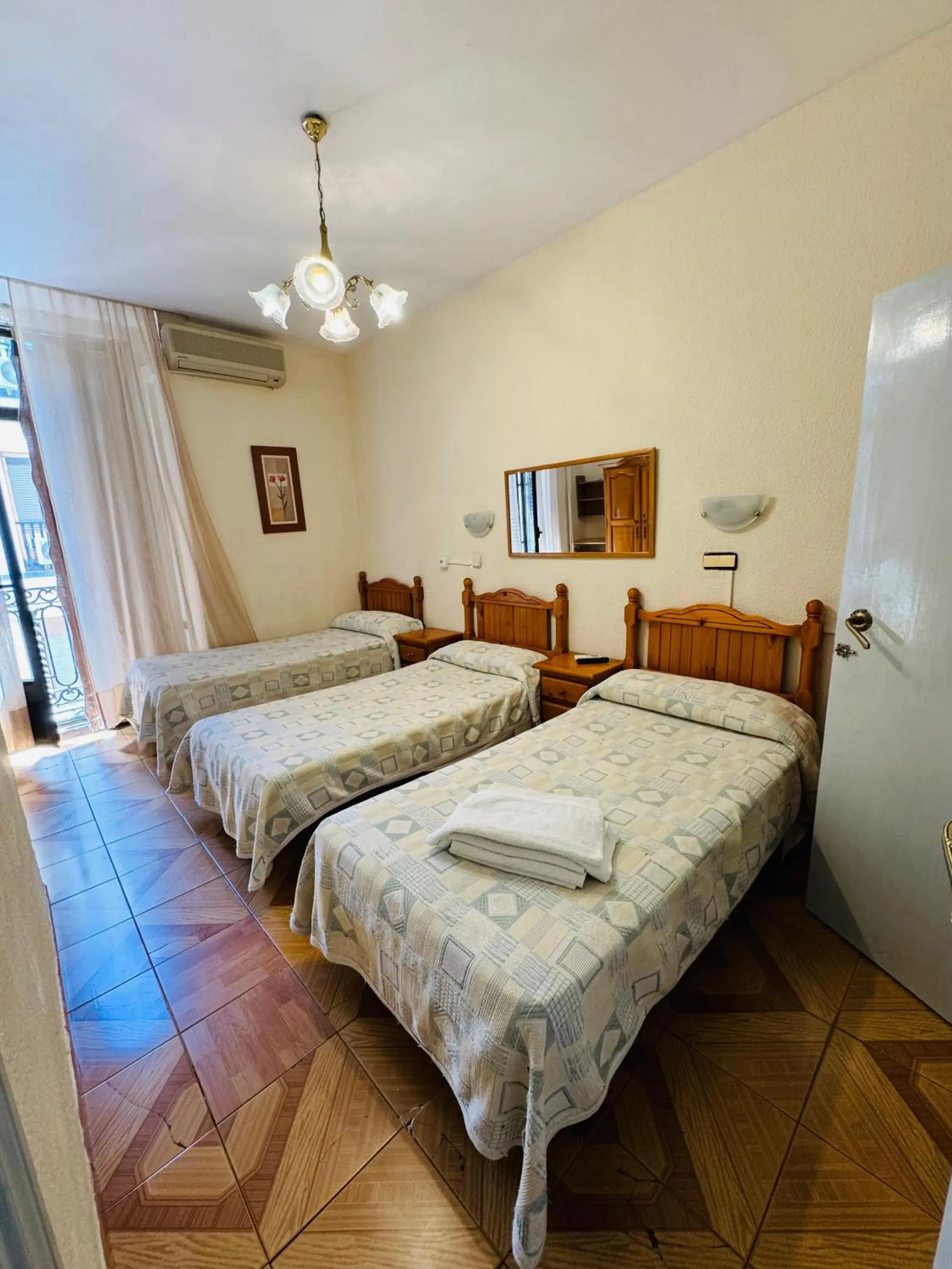 Triple Room in Hostal Fuentesol Triple Room in Hostal Fuentesol