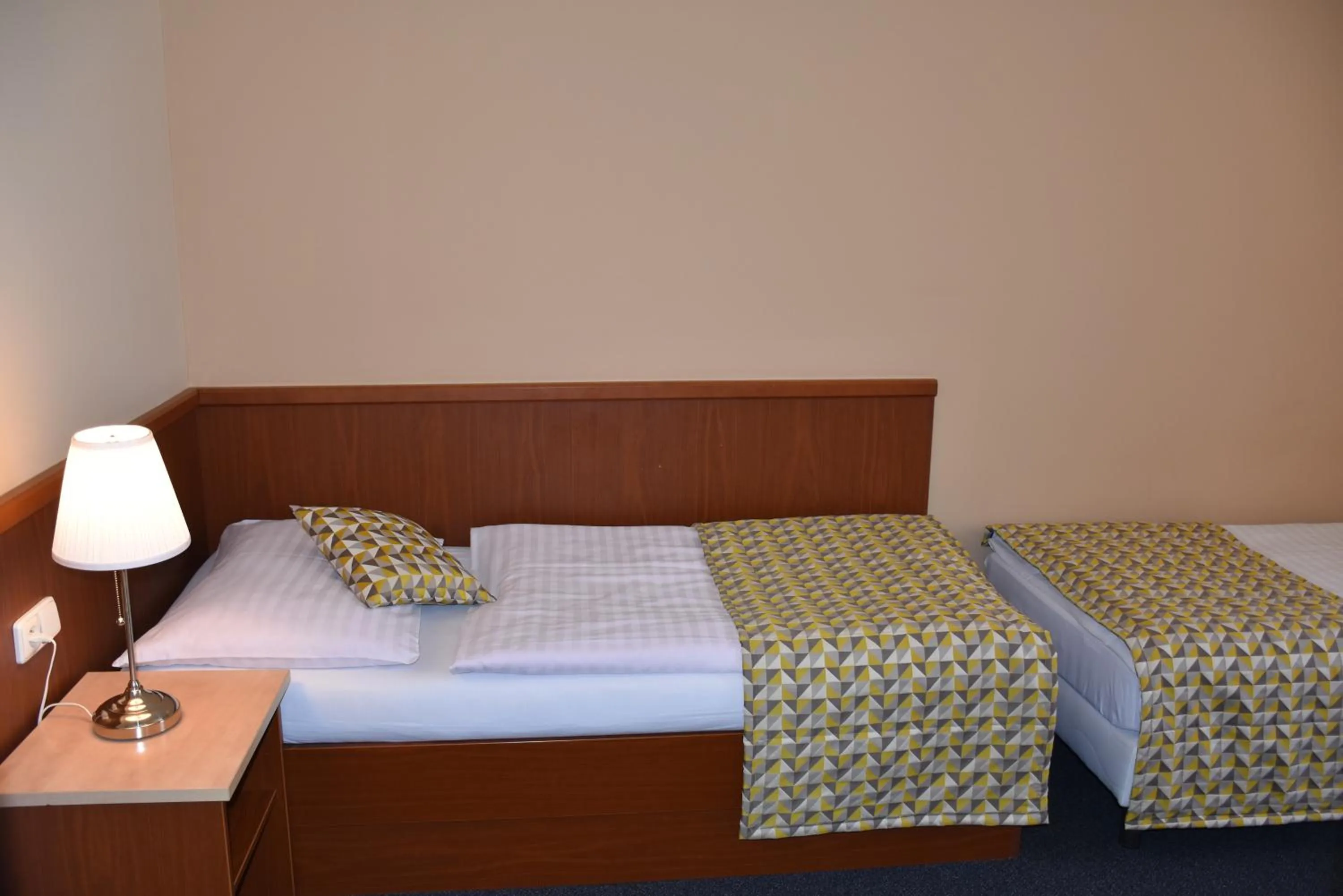 Bed in Aparthotel Austria Suites