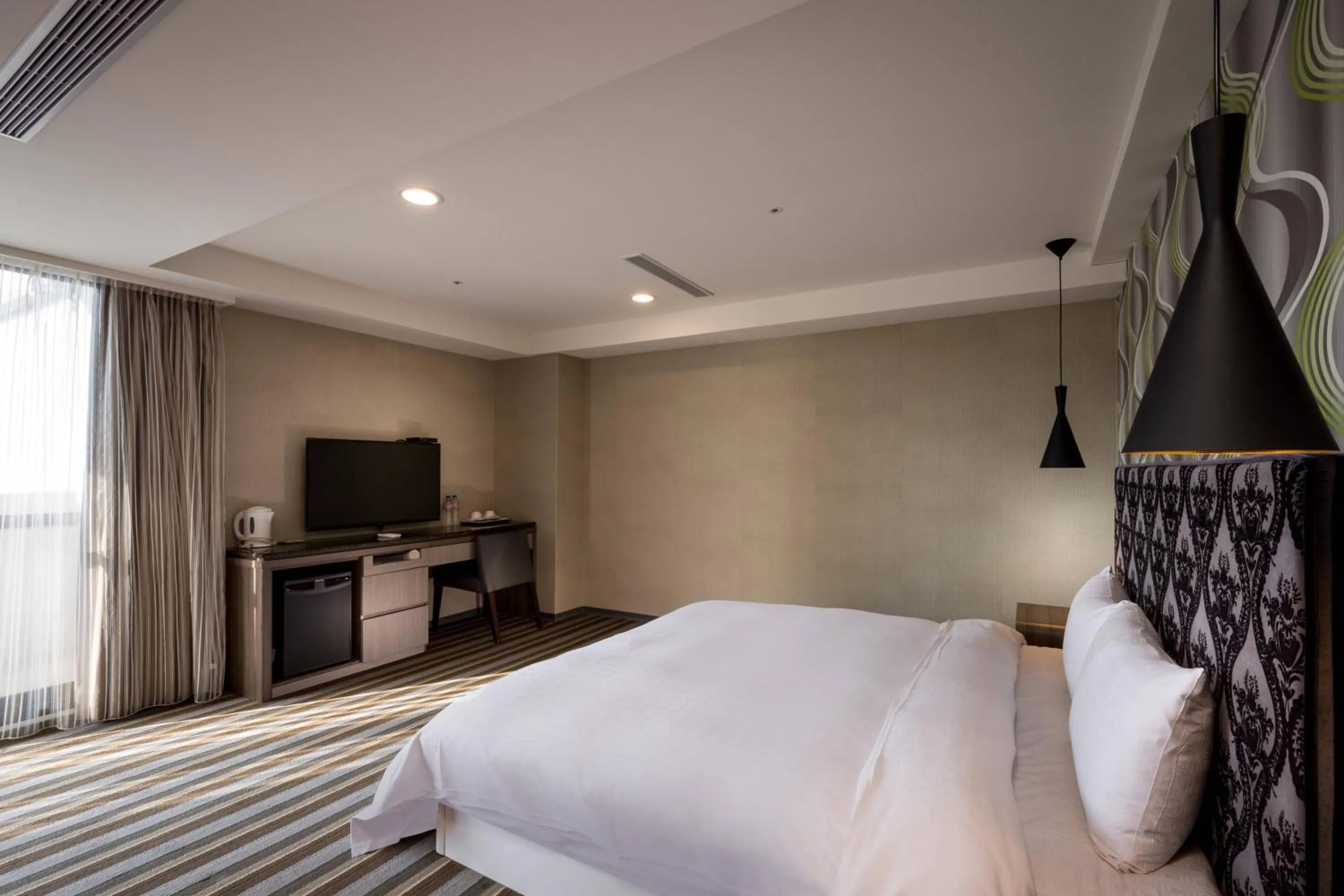 Bed in JUNG-ZAW BUSSINESS HOTEL