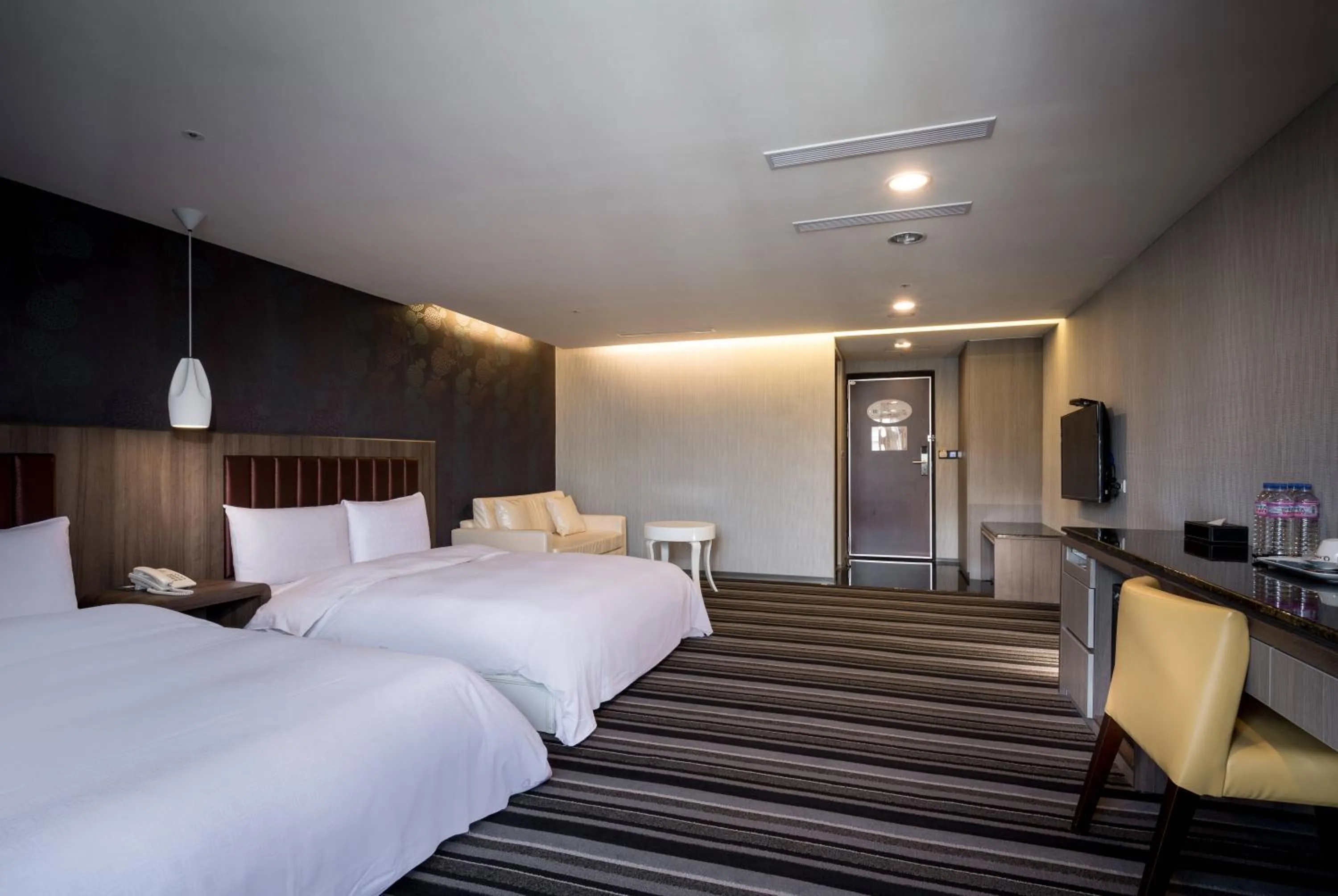 Bed in JUNG-ZAW BUSSINESS HOTEL