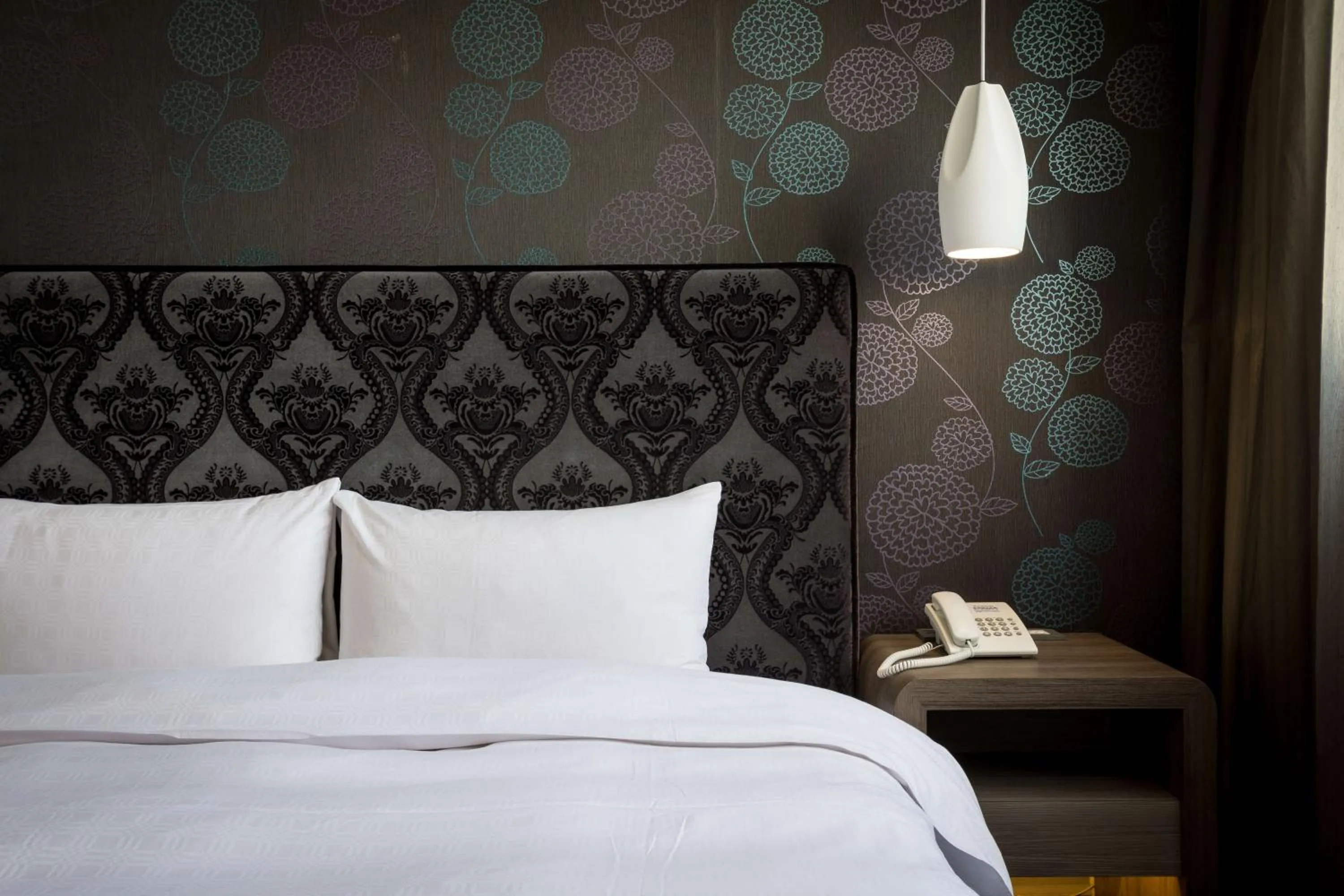 Bed in JUNG-ZAW BUSSINESS HOTEL