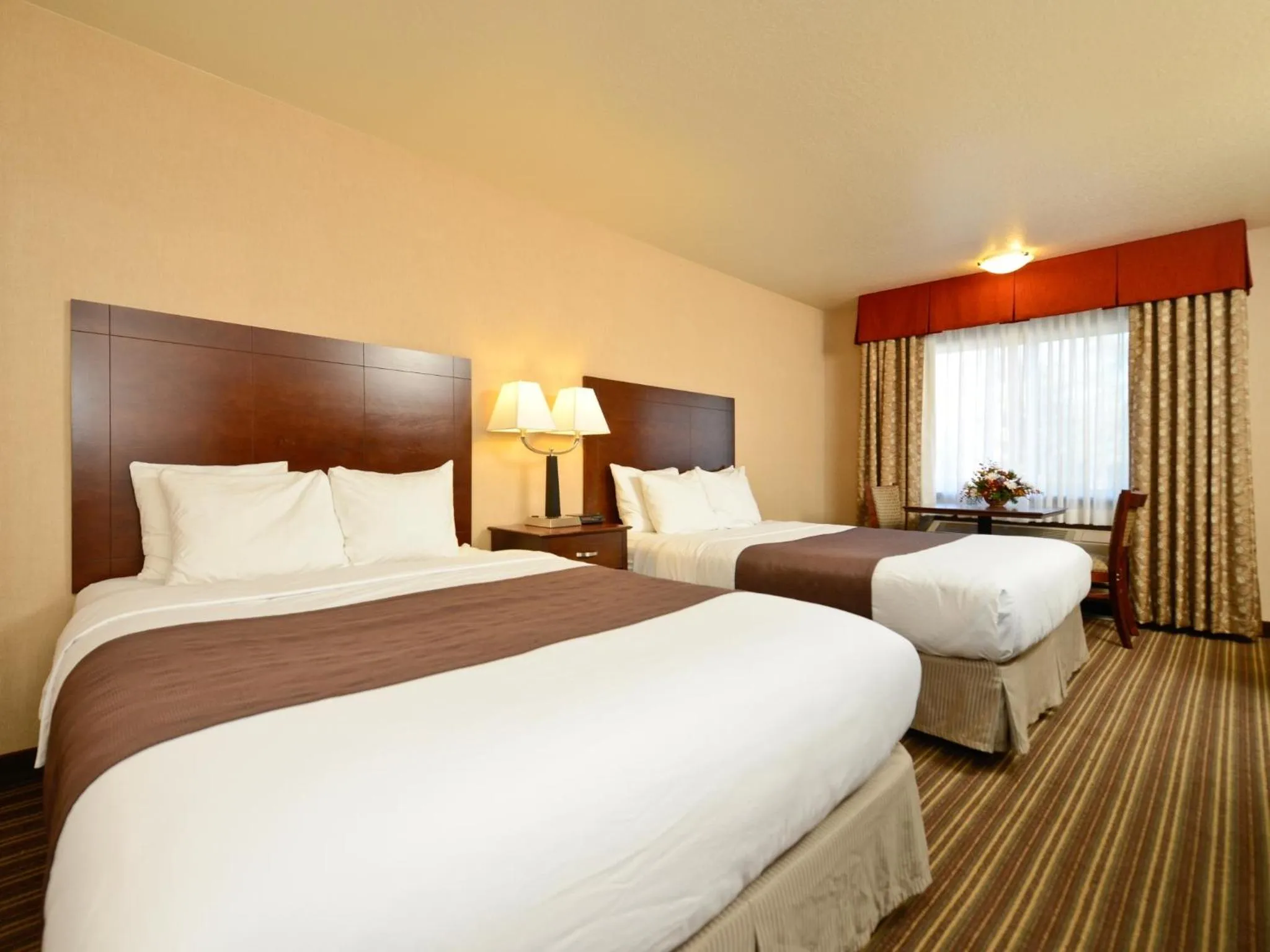 Bed in Yellowstone West Gate Hotel