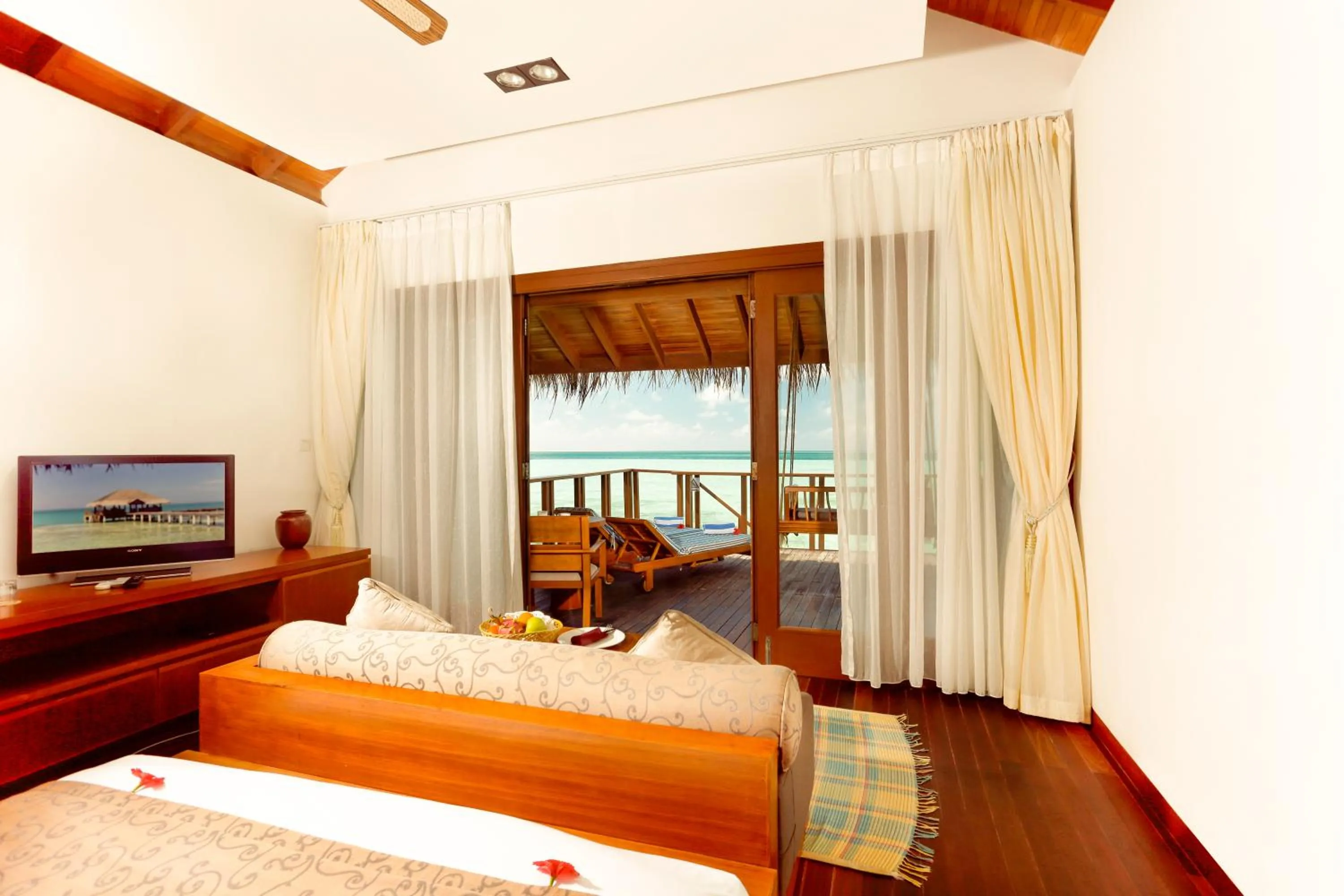 Bed in Medhufushi Island Resort