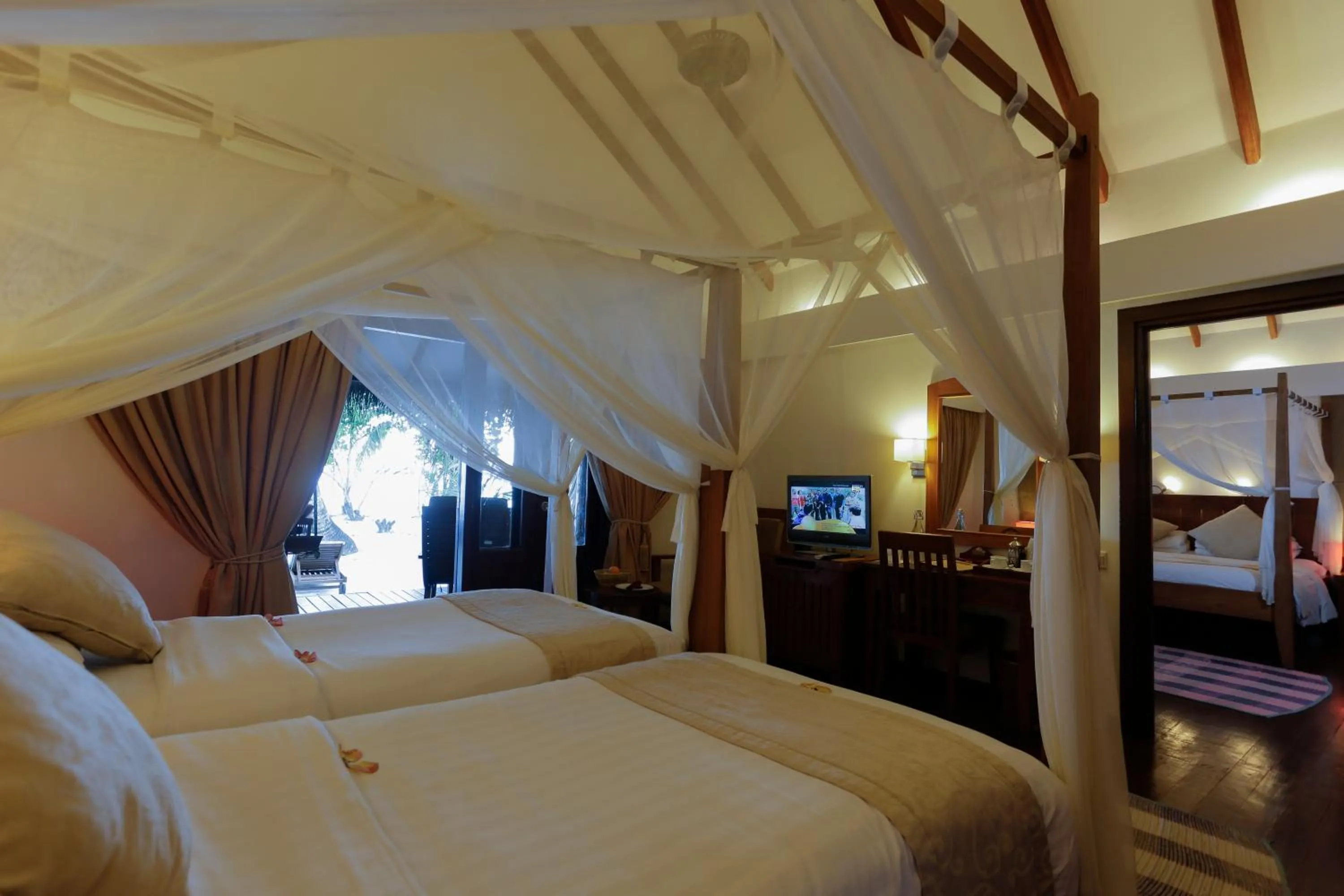View (from property/room), Bed in Medhufushi Island Resort