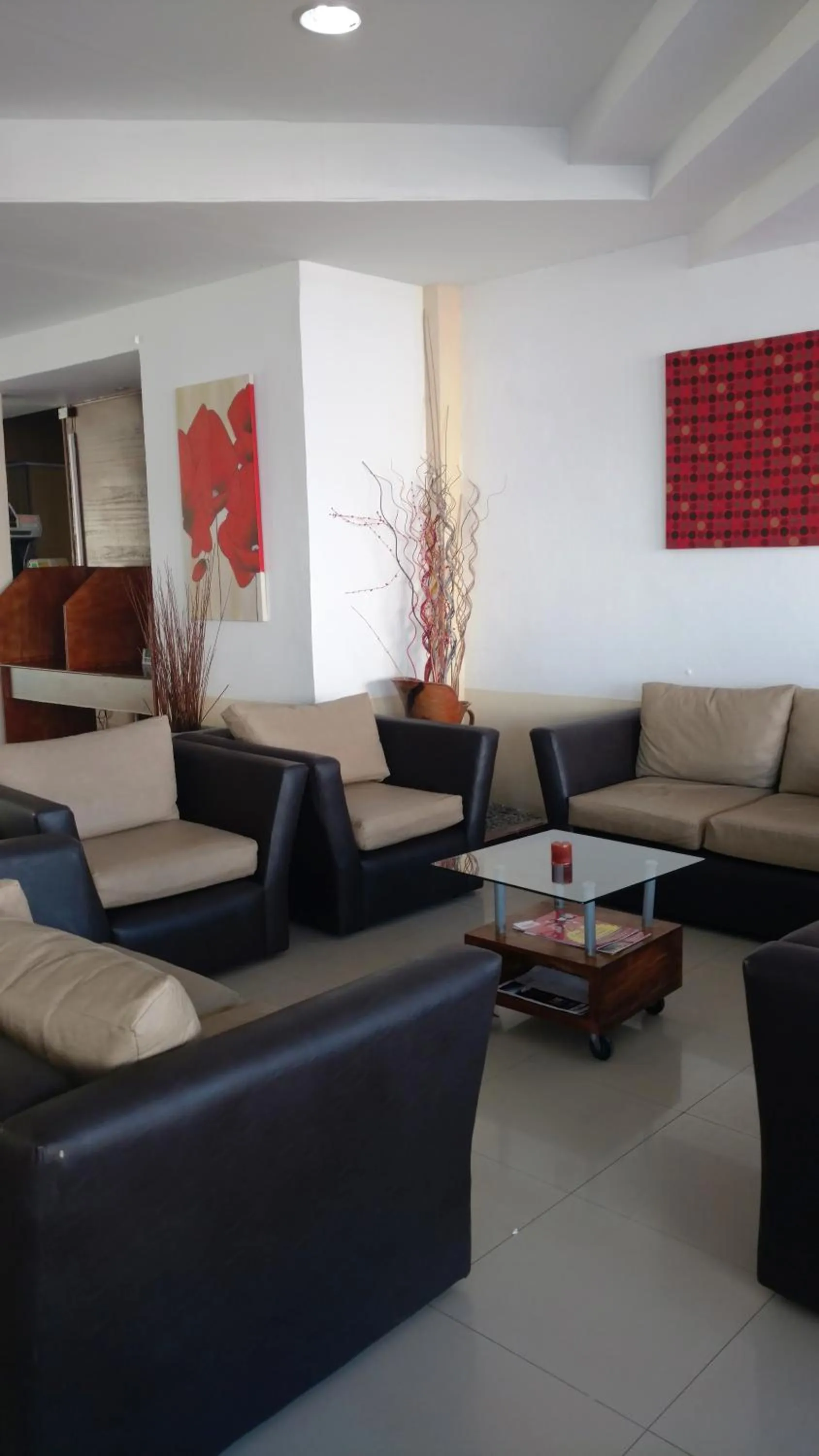 Communal lounge/ TV room in San Remo World Hotel