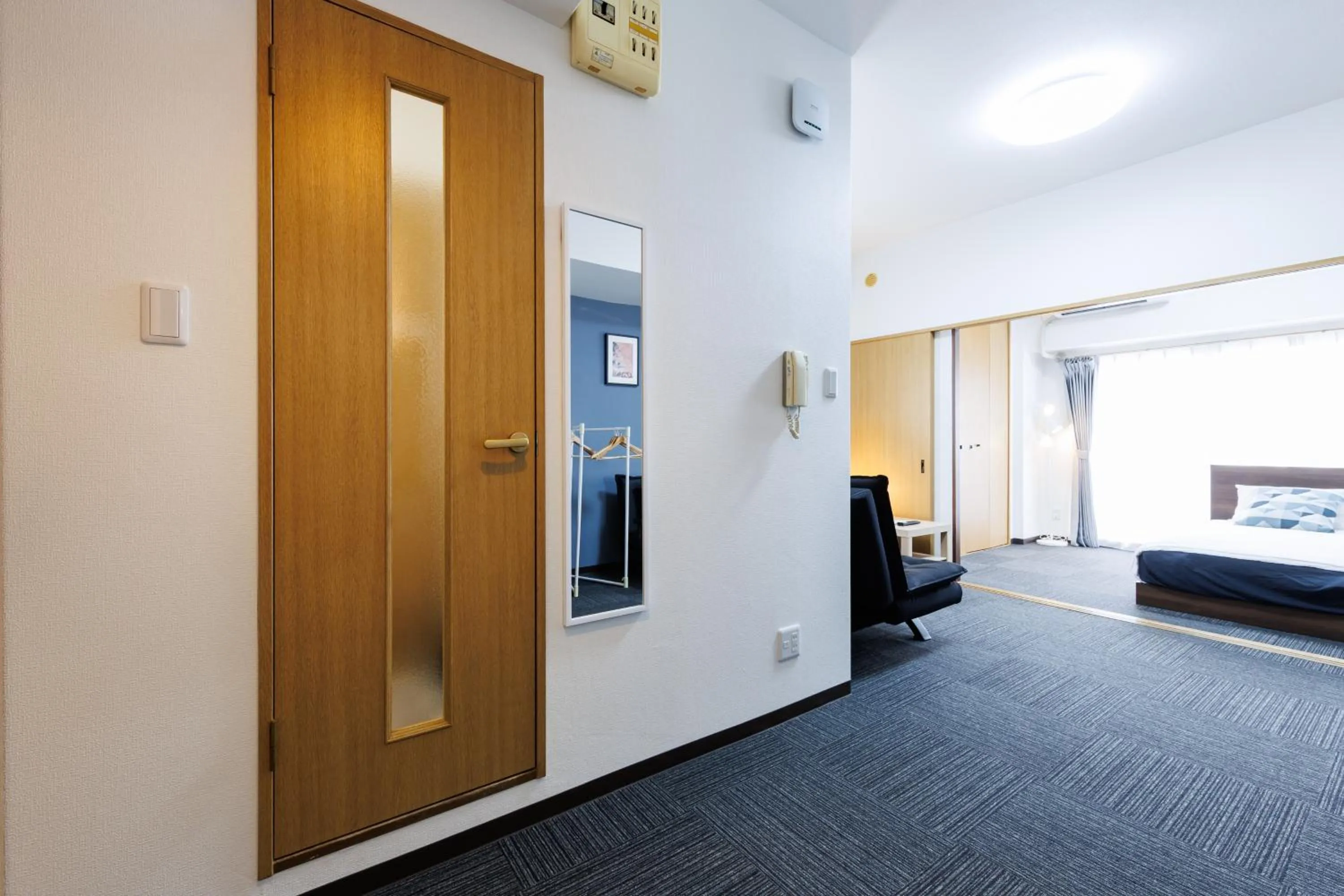 Bed in Grande Famille Shimanouchi Dotonbori Condo