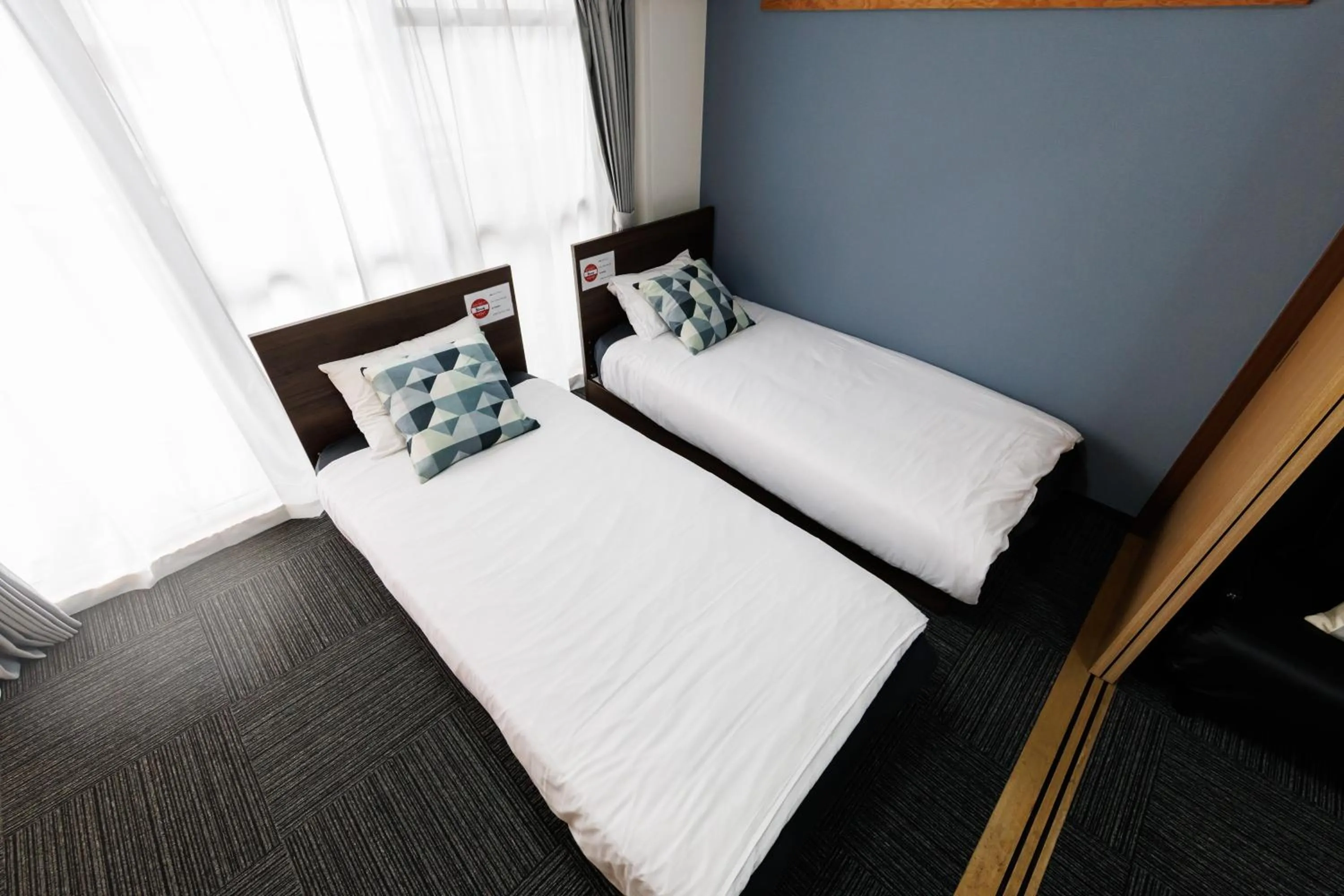 Bed in Grande Famille Shimanouchi Dotonbori Condo