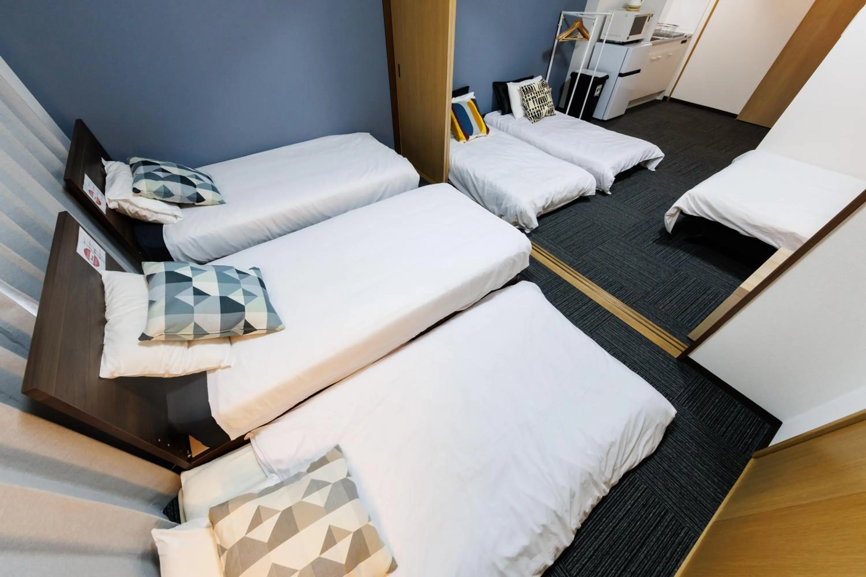 Bed in Grande Famille Shimanouchi Dotonbori Condo