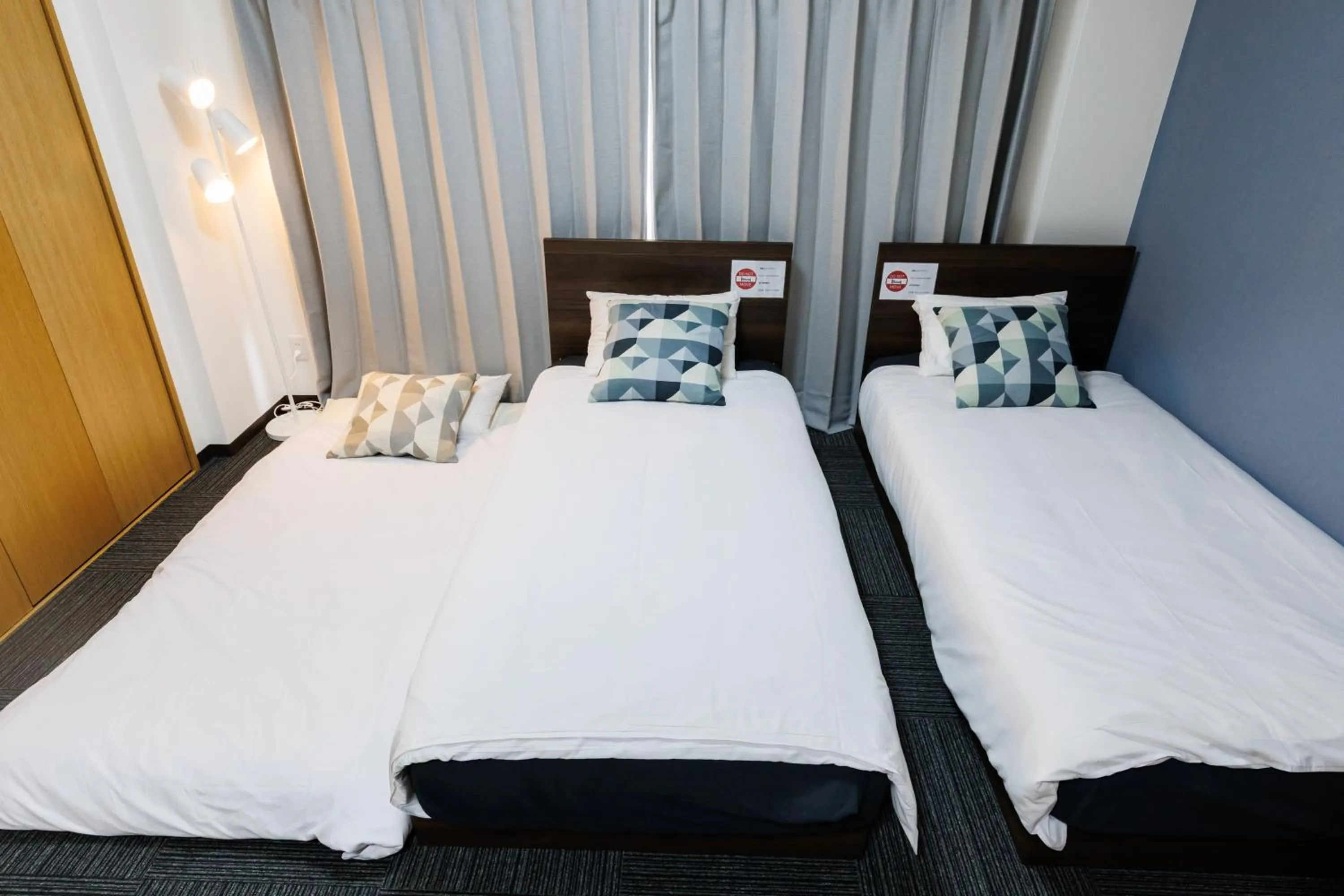 Bed in Grande Famille Shimanouchi Dotonbori Condo