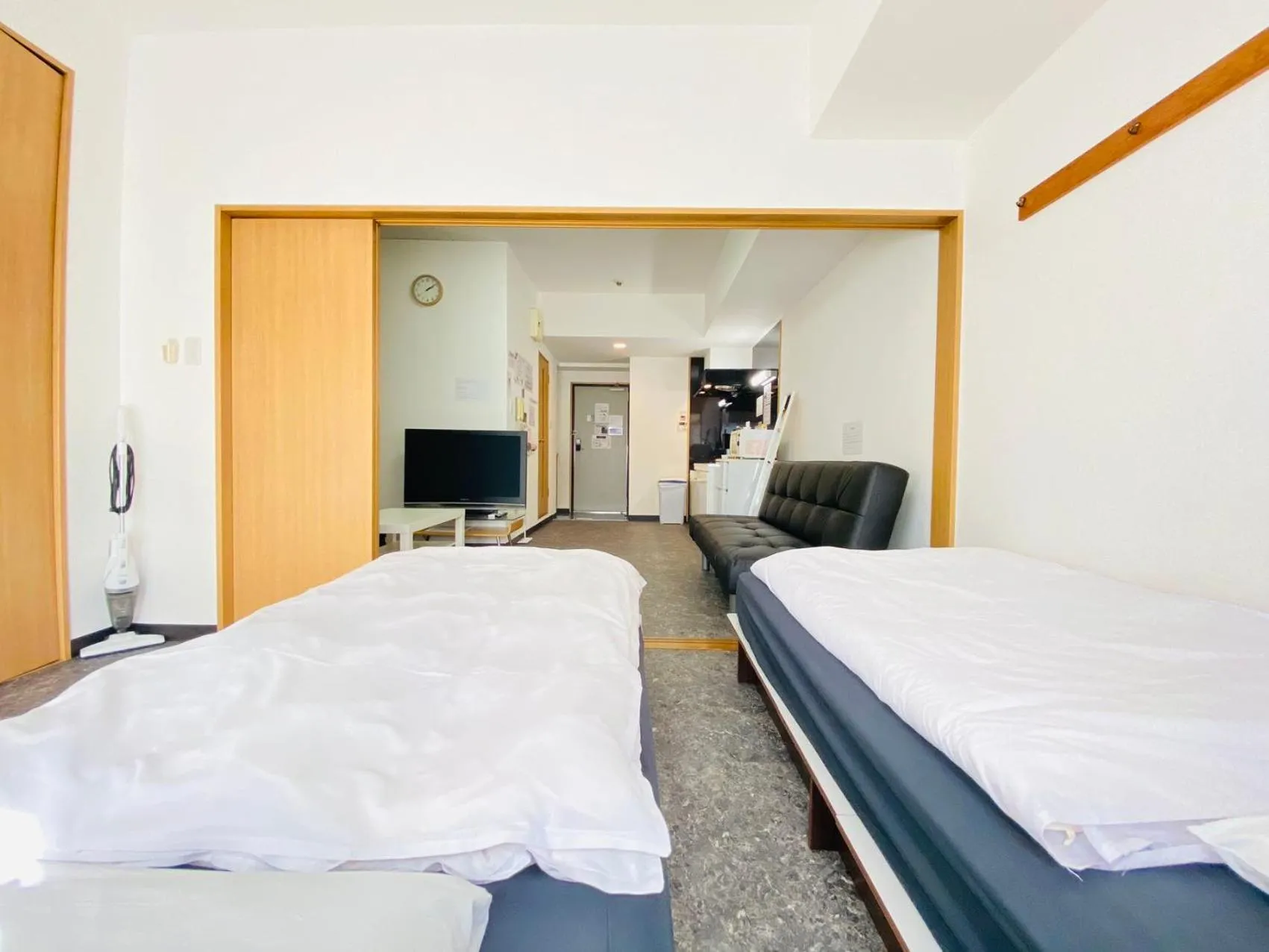 Bed in Grande Famille Shimanouchi Dotonbori Condo