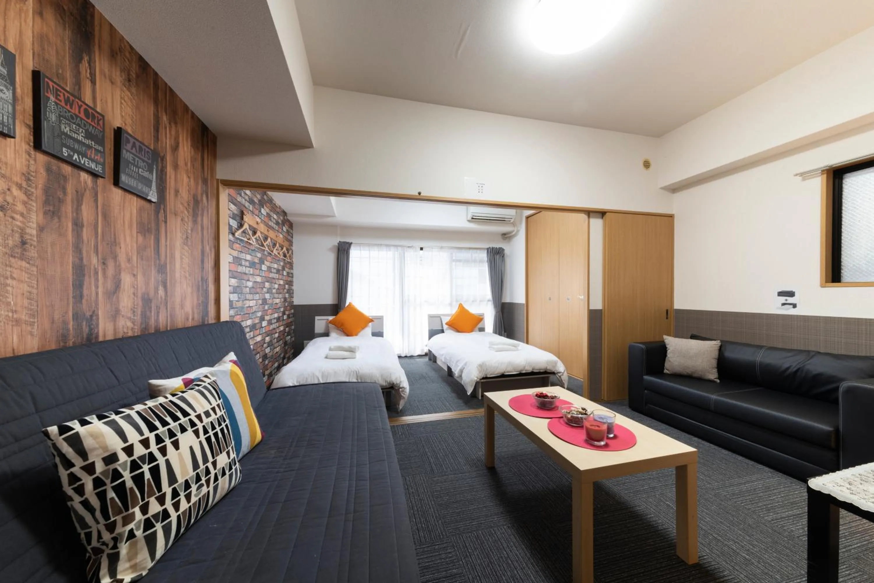 Bed in Grande Famille Shimanouchi Dotonbori Condo