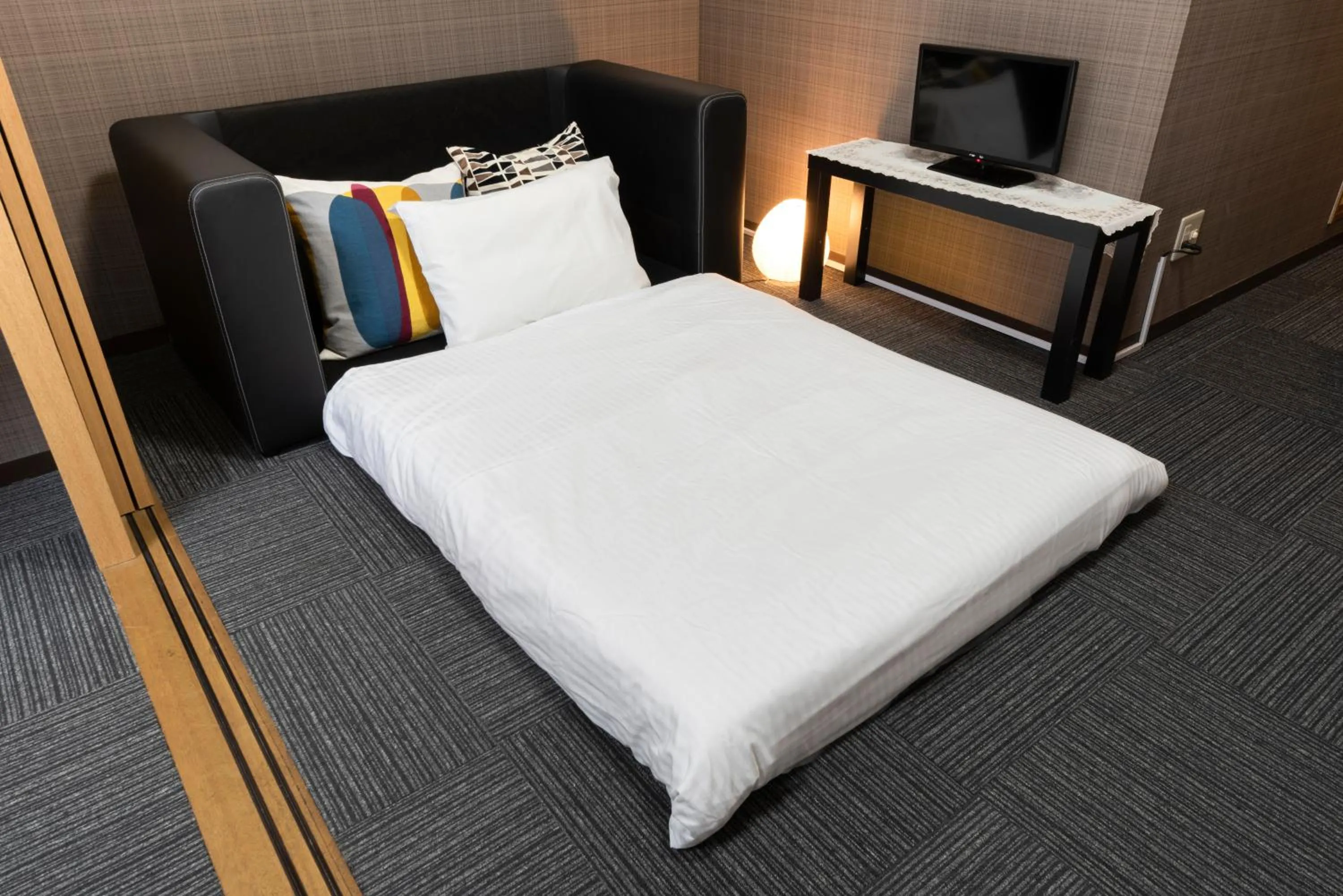 Bed in Grande Famille Shimanouchi Dotonbori Condo