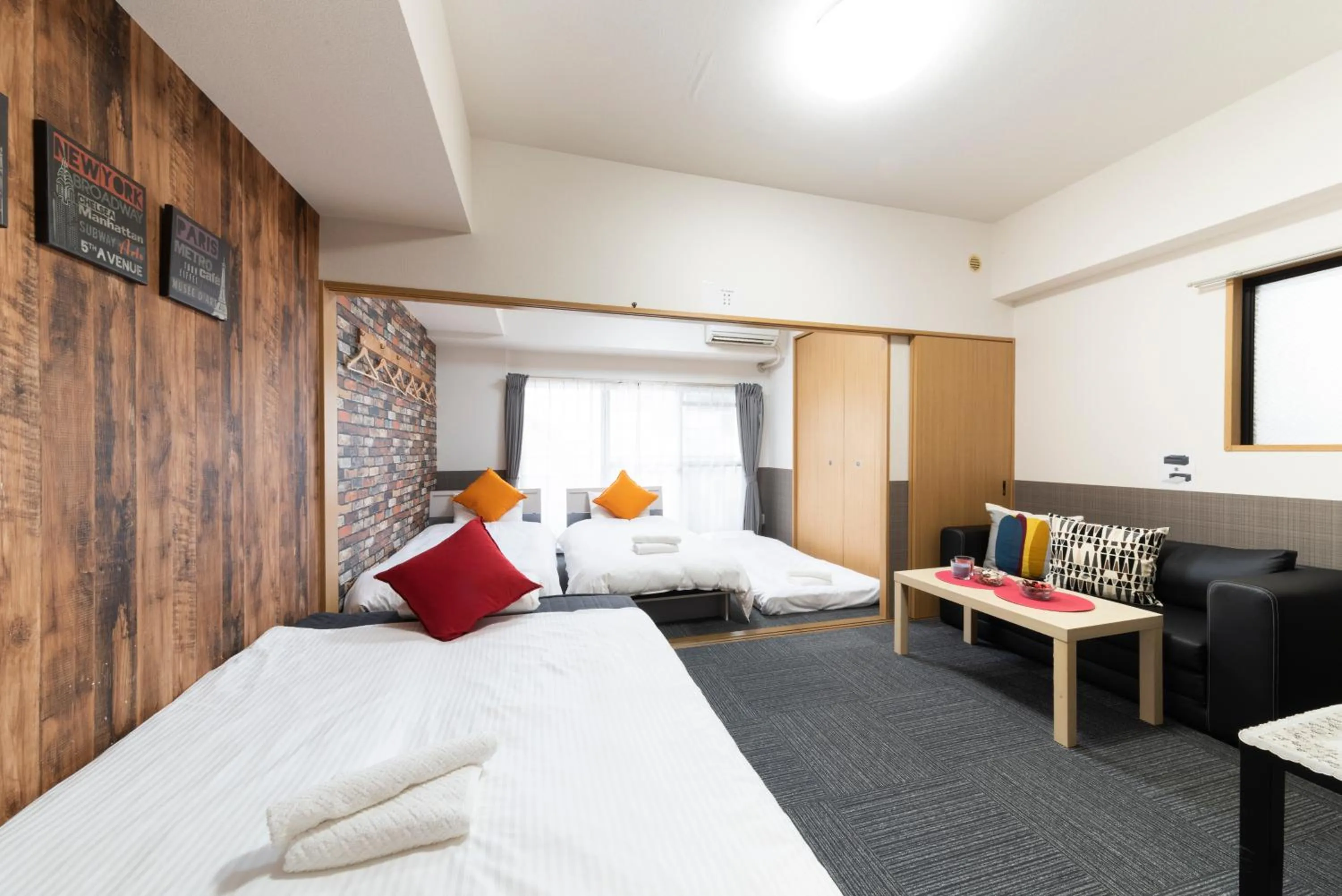 Bed in Grande Famille Shimanouchi Dotonbori Condo